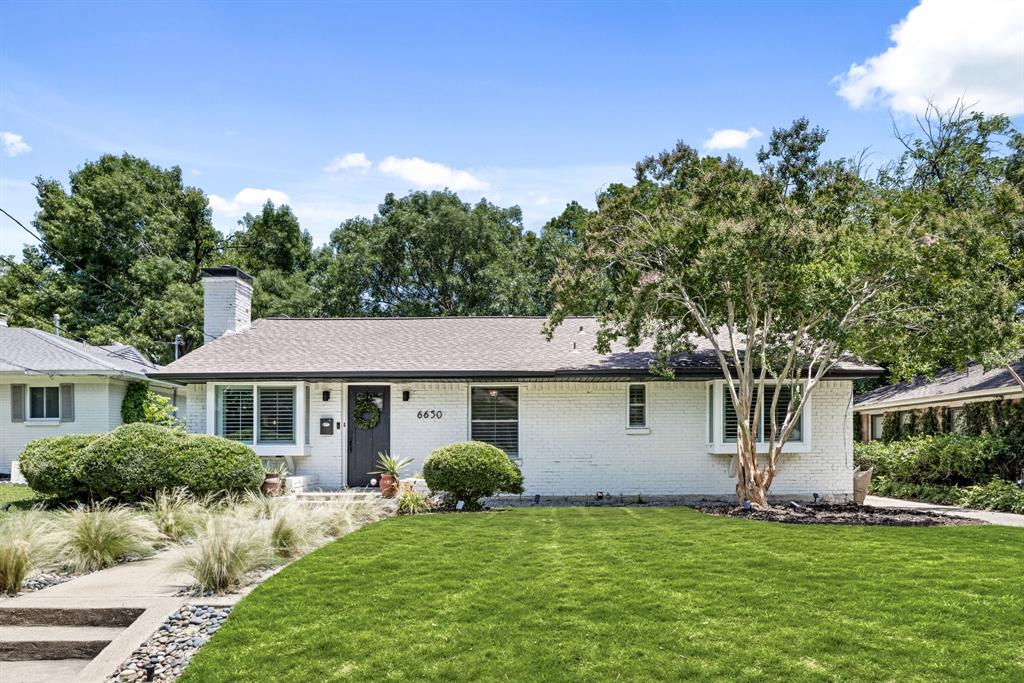 Nestled in the heart of coveted Ridgewood Park, this beautifully updated 3-bedroom, 2-bathroom ranch-style residence seamlessly blends mid-century character with sophisticated modern upgrades. Spanning 1,805 square feet, the home offers a versatile floor plan featuring two generous living areas, a cozy sunroom, and timeless hardwood floors throughout.
The updated kitchen is a polished showpiece—featuring sleek quartz countertops, stainless steel appliances, luxe tile accents, and custom banquette seating that adds both charm and function. A secondary prep area with an additional sink is perfect for effortless entertaining.
The serene primary suite serves as a private retreat, complete with a spa-like bath showcasing his-and-hers vanities, a rainfall shower with built-in bench seating, and elevated designer finishes. The secondary bedrooms are equally inviting, offering ample light and flexibility for guests or work-from-home needs.
Outdoors, a lush, fenced backyard provides an ideal escape with a brick patio, cozy firepit, and manicured landscaping designed for low-maintenance enjoyment. A detached two-car garage offers generous storage and secure parking.
Located just minutes from White Rock Lake, walking trails, and local hot spots, this Ridgewood Park gem offers the perfect balance of tranquility and convenience—bringing comfort, style, and livability together in one beautifully packaged home.