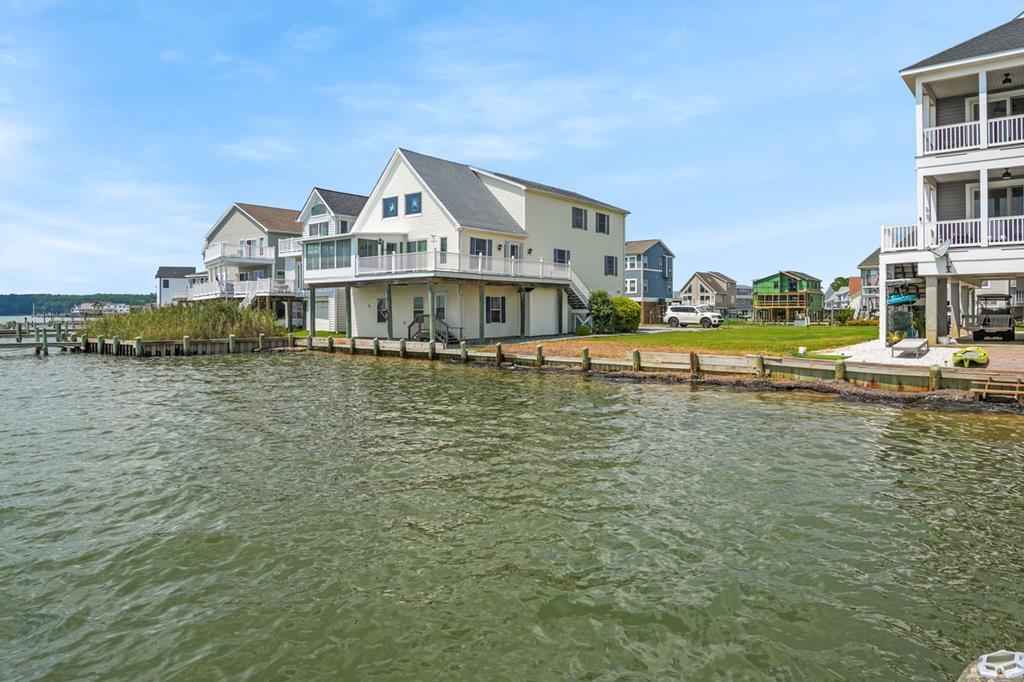 Discover the stunning beauty of Lot 1000 Bayside Dr in the amenity-rich community of Captain's Cove. This premier bayfront lot offers a tranquil setting with a pristine sandy beach, perfect for relaxing and making lasting memories. Enjoy breathtaking, spectacular sunsets that paint the horizon in vibrant colors each evening, creating a truly mesmerizing view. Whether you're looking to build your dream home or a vacation retreat, this exceptional property combines natural beauty with the luxurious amenities of Captain's Cove, making it the ideal waterfront oasis.