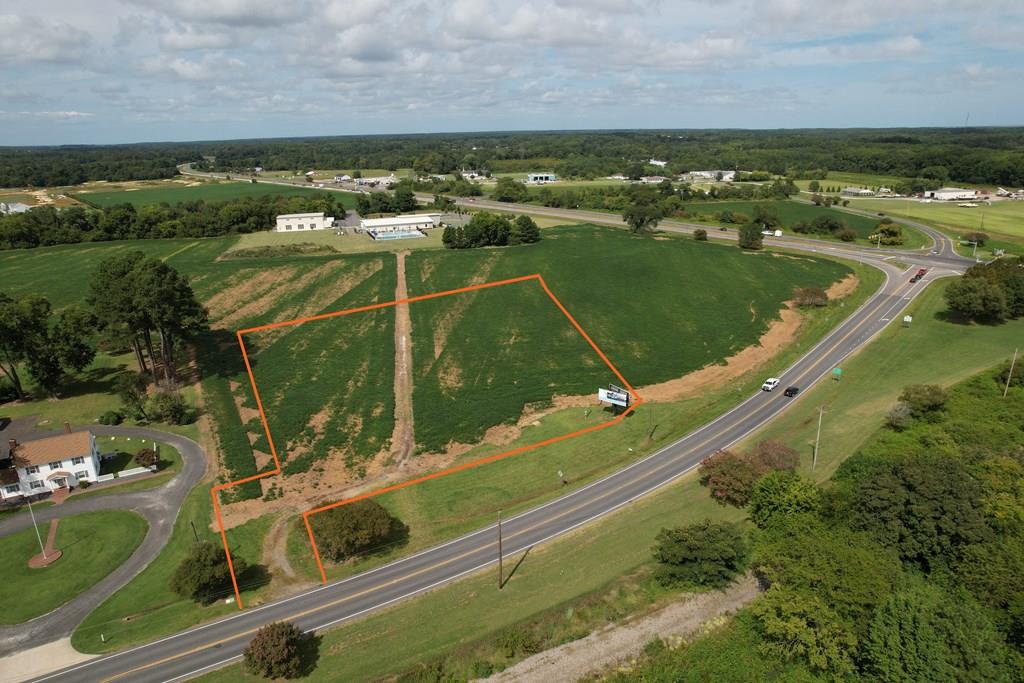 Two lots combined on Stone Road, a gateway location at the entrance to Cape Charles town with excellent visibility, with point of access suitable for commercial use included by survey as shown. Presently zoned Town Edge 1 (TE1) for multiple uses by right, including single family residential or Agriculture/Rural Business, farmstands, bike shops, outfitter services, seasonal sales, tourism info, etc. Great exposure for seasonal rental homes or any of these other uses. Next YMCA & adjoining VDOT highway land on the east. Potential for rezoning to commercial as nearby and across the street properties have been recently approved the same way. A ground floor opportunity to join the exciting renaissance of Cape Charles. Orange property Lines shown on photos are approximate only.