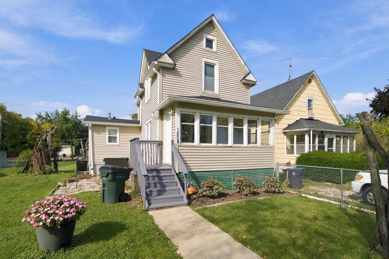 Welcome to this spacious 2-bedroom home situated on an oversized 57 x 150 lot! Enjoy a generously sized eat-in kitchen, convenient main-level laundry, and a walk-in pantry offering plenty of storage. The home also features an enclosed front porch and a full basement with exterior access, providing additional storage possibilities.  Step outside to an expansive backyard with plenty of room for entertaining, summer BBQs, family gatherings, or creating your very own vegetable garden! Numerous updates include the driveway (approximately 2020), kitchen, bathroom, roof and siding (2022), air conditioner (2024), and one side of the fence (2025). Conveniently located near Jewel-Osco, Aldi, Walmart, restaurants, and everyday shopping, with access to Route 173, US-41, and I-94. A wonderful opportunity to enjoy spacious living and a generous outdoor setting. Property is being sold AS-IS.