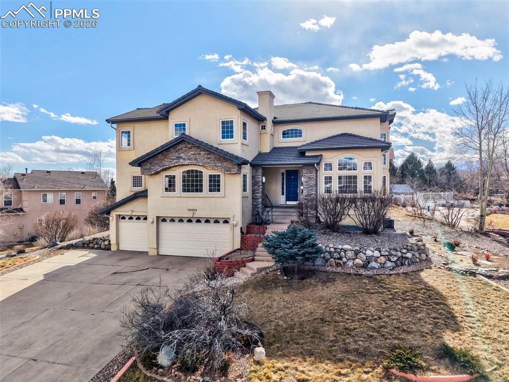 Views abound in this stunning open floor plan masterpiece of a home. Walking into the foyer you’re greeted by a grande staircases that ascends to the second floor. The home opens with picturesque windows and natural light flooding throughout. The living room impresses with a gas fireplace for those colder Colorado nights and has walkout access to the back deck for beautiful views to enjoy your morning cup of coffee in the summer. Just off the living area the formal dining room is the ideal place for dinner parties as you welcome guests for a housewarming. Walking through to the kitchen you are greeted with ample cabinet and counter space, a breakfast bar, double oven, gas range, and views galore as you peer out the windows beyond the kitchen sink. Back towards the front of the home french doors open to a spectacular office space with built ins creating the perfect space for the at home worker. Completing the main level is bedroom one with a full bath and another half bath for guests. Walking up the stairs you are greeted by a landing that is spacious enough to be utilized as a nice sitting/reading area. The upper level has three bedrooms including the primary suite. The primary has a gas fireplace, separate seating area, ensuite 5 piece bath, and walk-in closet. Bedroom three and four both have their own ensuite bath as well. The basement level is just as pristine with a large family room and two bedrooms which share another full bath. This home sits on a pinnacle piece of property with an ideal location near the USAFA with easy access to I25 and all the shopping and entertainment that Colorado Springs has to offer.