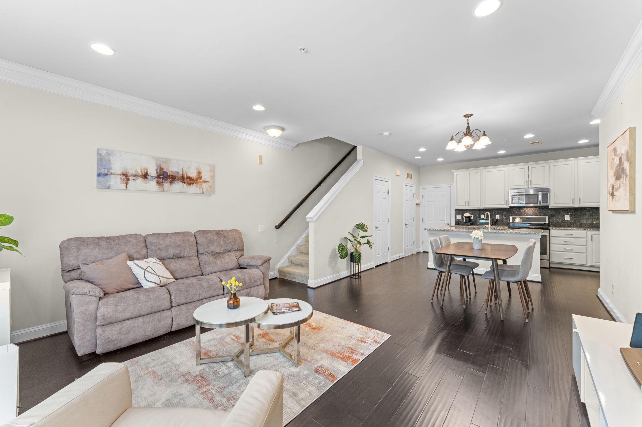 This contemporary townhouse in Goose Creek Village North offers 1,492 sq. ft. of modern living space with 3 bedrooms and 2.5 bathrooms. The open floor plan features a stylish kitchen with an island, stainless steel appliances, and built-ins, perfect for entertaining. Enjoy the convenience of upper-floor laundry and a walk-in shower in the master bath. The garage is equipped with a Tesla electric charger. Community amenities include a swimming pool, exercise room, dog park, and picnic area, fostering a vibrant neighborhood atmosphere. The well-maintained grounds feature tot lots and jogging paths, ideal for outdoor activities. Residents benefit from assigned parking and comprehensive maintenance services, including snow removal and lawn care. Located near top-rated schools and parks, this home provides easy access to essential public services. Experience a blend of comfort and community in this desirable location, making it an ideal choice for those seeking a balanced lifestyle.