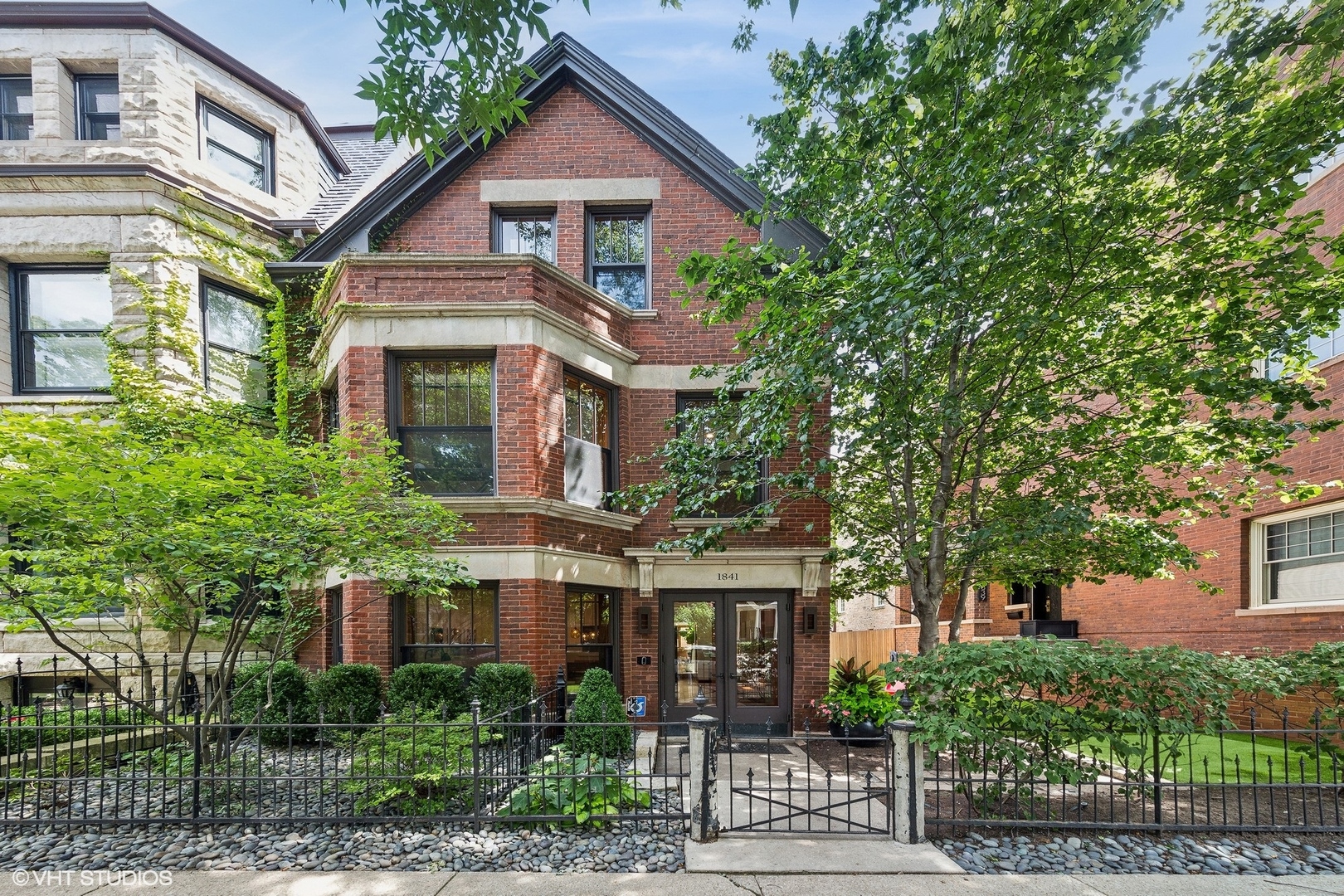 Exceptional Hartshorne Plunkard-designed contemporary renovation of a historic Old Town single-family home, thoughtfully crafted with sustainability in mind. Situated on an oversized lot in the prestigious Old Town Triangle, this remarkable residence is the only one of its kind to feature a beautifully landscaped side yard and a three-car garage with a green roof. Designed to maximize natural light, the home showcases expansive windows and elegant French doors that create a seamless connection between indoor and outdoor living. The interior is finished with sophisticated bamboo flooring throughout and a sleek Bulthaup kitchen equipped with top-tier appliances. With 5 bedrooms, plus Office and 4.1 bathrooms, the upper levels include a luxurious primary suite with a generous walk-in closet and a spa-inspired bath. Outdoor living is elevated with an expansive roof deck and a beautifully designed back patio, perfect for entertaining. The lower-level recreation room, complete with a bar and full bath, adds additional versatility for relaxation and hosting. This is a rare and extraordinary opportunity to own a thoughtfully designed masterpiece in one of Chicago's most sought-after neighborhoods.