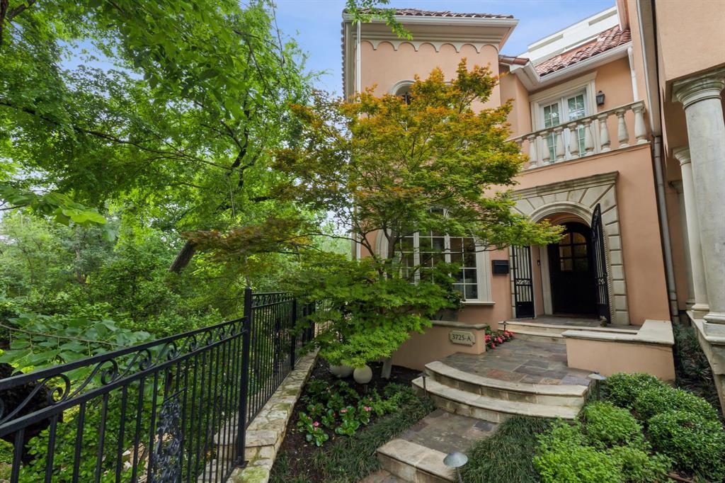 This designer-decorated masterpiece is an urban oasis in the heart of the city. Designed by the same architect who designed the Mansion hotel, this end-unit townhouse stands as a testament to modern elegance, spanning 3 meticulously designed levels with dedicated elevator access to all floors. Entering the spacious foyer, beautiful formals accentuated by arched cased openings & matching arched windows welcome you in with treetop views overlooking your private, 0.468 acre garden oasis. At the core of this designer showpiece is the chef’s kitchen, where form meets function. This gourmet space overlooks the outdoors & is ideal for culinary artistry & sophisticated entertaining. Adjacent, the keeping room offers versatile elegance with built-in storage & a gas fireplace, perfect for intimate gatherings or serene relaxation. The ground level offers a chic bedroom with ensuite bath, complemented by a living area replete with built-ins, full bath, & wet bar with beverage fridge, creating a perfect retreat for guests or multi-generational living. Outside, the meticulously curated private garden offers a tranquil escape in the midst of Dallas’ vibrant urban scene, complete with terraced greenery, towering trees, mature landscaping, several sitting & lounging areas, a wood-burning fireplace, and graveled walking paths. An attached 2-car garage & private, owner-dedicated parking spaces for four additional vehicles within the gated complex complete the home's convenience. Enter the top floor to find the primary suite, two additional generously proportioned bedrooms with ensuite baths, & a conveniently located laundry room. The primary suite was designed with serenity & escape in mind - a private sanctuary, featuring one of many private balconies, a cozy sitting area, designer fireplace, & luxurious marble bath. Every detail of this residence is a testament to thoughtful & curated luxury, offering unparalleled functionality & bespoke style in an exclusively unique urban setting.