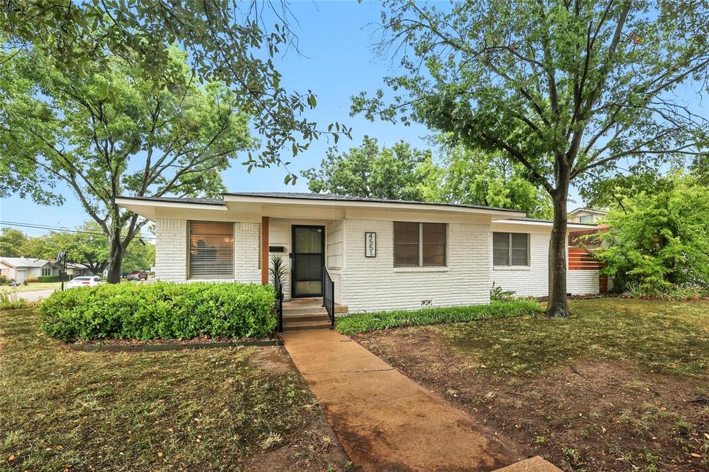 Welcome to 4551 Cockrell Avenue — a thoughtfully updated single-story Traditional home that strikes the perfect balance between timeless character and modern convenience. Situated on a tree-lined corner lot in Fort Worth’s desirable South Hills neighborhood, this residence is ideal for those who value location, light-filled living spaces, and smart outdoor functionality. Step inside to discover a bright, open-concept layout with refinished hardwood flooring, updated lighting, and an effortless flow between the living, dining, and kitchen spaces. The heart of the home is a designer-inspired kitchen featuring open shelving, stainless appliances, butcher block countertops, and a charming center island — perfect for everyday cooking or hosting friends. The primary suite is a relaxing retreat, featuring dual closets and a completely updated ensuite bath with a spa-style walk-in shower. Two additional spacious bedrooms provide flexibility for guests, family, or home office use. Outdoors, the private backyard is a true urban oasis. Enjoy dinners al fresco on the deck, tend to your plants in the greenhouse, or simply unwind beneath the mature shade trees. The backyard also features a storage shed, wood privacy fence, and ample space for entertaining or gardening. With quick access to parks, dining, shopping, and highly rated schools, this move-in ready gem offers both comfort and lifestyle—an ideal home for today’s modern Fort Worth buyer.