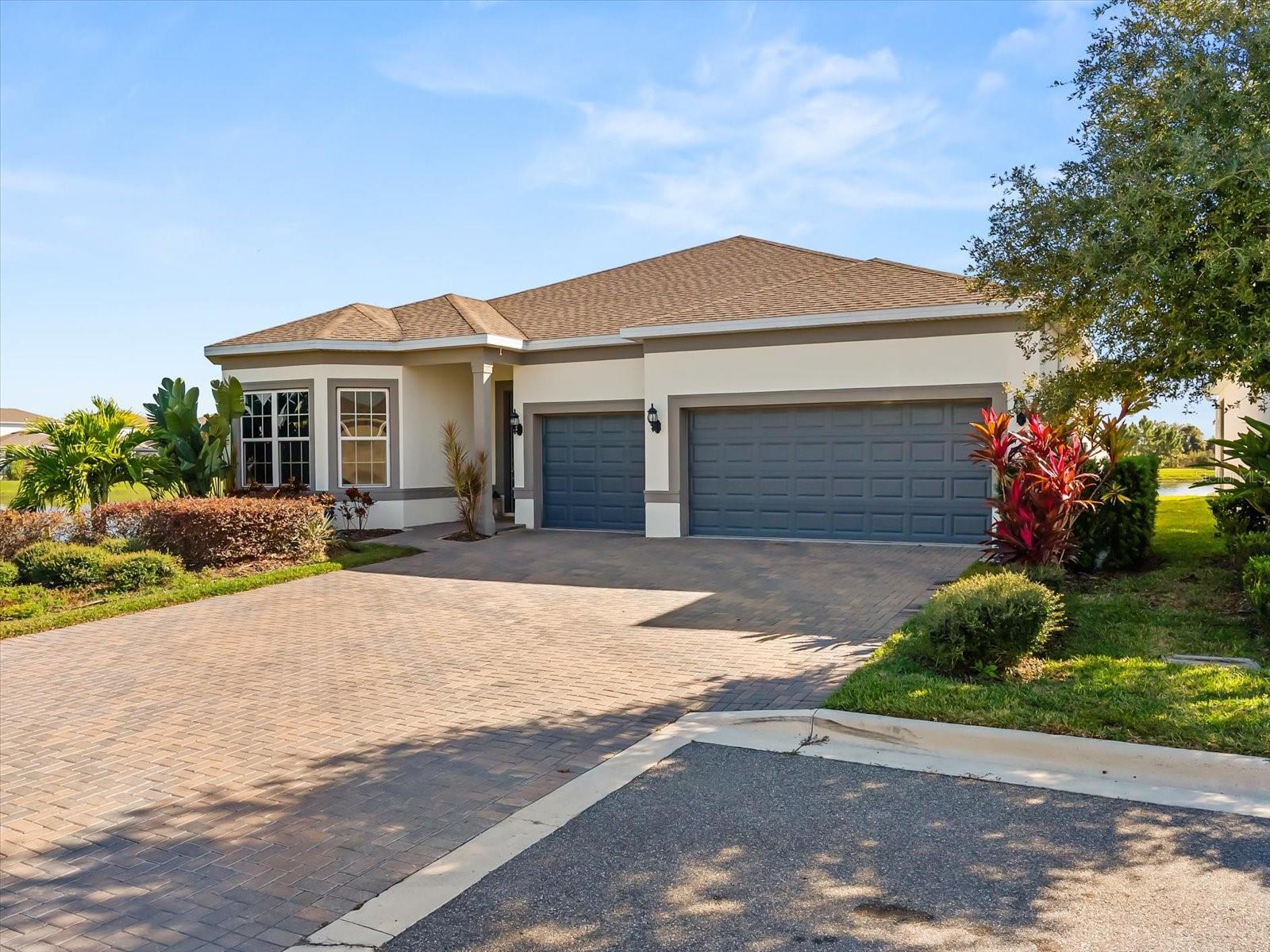 One or more photo(s) has been virtually staged. One or more photos are digitally staged. HUGE PRICE IMPROVEMENT on this Luxury Single-Family Home in Lake Nona's Premier Community The Isles of Lake Nona. Step into this stunning residence, where luxury meets functionality in the highly desirable Lake Nona community of The Isles. Built in 2021(Roof, structure, A/C, and water heater still under warranty) and situated on a peaceful cul de sac, this home boasts the best lake view in the community, providing a serene backdrop for your daily life and entertaining. The expansive oversized driveway and a three-car garage make parking a breeze, perfect for family and guests.This exquisite property features elegant luxury vinyl plank flooring throughout, creating a warm yet sophisticated ambiance. The formal dining area seamlessly connects to a spacious open-concept family room with soaring ceilings and the gourmet chef’s kitchen, designed for both everyday living and entertaining. The luxurious chef’s kitchen is equipped with a gas stove, ideal for culinary enthusiasts, and offers ample cabinetry and counter space for all your culinary needs.The home hosts four spacious bedrooms, including a luxurious primary suite with a stunning water view, and 3 modern bathrooms. Additionally, one of the bedrooms can work as an office/flex room perfect for remote work or additional guests. The laundry room comes complete with a utility sink, and washer and dryer, both included for your convenience.Enjoy outdoor living at its finest with a covered lanai that overlooks the most breathtaking water views in the community, a perfect setting for relaxing evenings or entertaining friends. Residents of The Isles of Lake Nona enjoy a resort-style lifestyle with amenities including a sparkling pool, splash pad, clubhouse, fitness center, tennis, basketball, and pickleball courts, as well as playgrounds. The HOA takes care of fiber internet, exterior pest control, lawn care, irrigation, and gated entry, offering a truly maintenance-free lifestyle. Conveniently located just minutes from major highways like the 417 and Medical City, you'll have easy access to attractions such as Boxi Park, Drive Shack, Nona Adventure Park, and the trendy Wave Hotel, along with a wide variety of restaurants and shopping options around Lake Nona.Don't miss this rare opportunity to own a luxurious, move-in ready home in one of Orlando's most sought-after communities. Contact us today to schedule your private tour and experience the perfect blend of luxury, location, and lifestyle in Lake Nona!Your Dream Home Awaits. Schedule Your Visit Today!