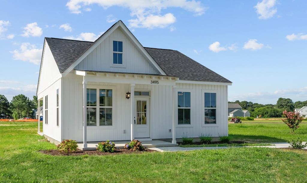Welcome to this exquisite coastal cottage, nestled in Cape Charles—a town known for its small-town charm and stunning Chesapeake Bay sunsets. Step inside to discover an open and airy layout featuring 2 generously-sized bedrooms and 2 elegant full bathrooms. The centerpiece of the home is a gourmet kitchen—thoughtfully upgraded with appliances, premium cabinetry, and luxury finishes that are perfect for entertaining or enjoying a quiet evening in. Set on an expansive nearly half-acre lot in the Tower Hill neighborhood, this property offers ample outdoor space for gardening, recreation, or future expansion. Whether you're relaxing on the porch with a coastal breeze or hosting a gathering under the stars, this home offers the perfect blend of comfort and style.