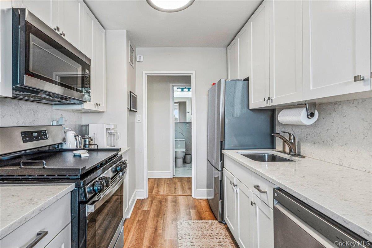 Rare Opportunity Luxury 2 Bedroom Deluxe Coop . Centrally Located.  Move in Ready. Beautifully Updated Kitchen + both Bathrooms , Hardwood Floors, ,Oversized Living Room , Dining Room, 2 Full Baths, 2 Terraces, Beautiful South East Views of Little Neck Bay, . Multiple Closets includes 2 Walk in Closets . Amenities Include 24 Hr. Doorman, Shopping Arcade(Beauty Spa ,Deli,Dry Cleaners and Card Room). Heated Pool, Full Service Health Club,5 Tennis/Pickle Ball Courts. Close To Bay Terrace Shopping Ctr. Express Buses To Manhattan. NYCT Bus To LIRR (Bayside) Station & Flushing Main Street Subway Located One Block Away. Total Maintenance $1994.94 + Assessments  $150.+ $227.79 = $2322.73 Includes Central A/C, Heat, Gas, Electric, Water & Real estate Taxes. Indoor Parking Available @ $190 Month. Special Spectrum pkg available Cable +Internet $70 per month. Appearance:Excellent