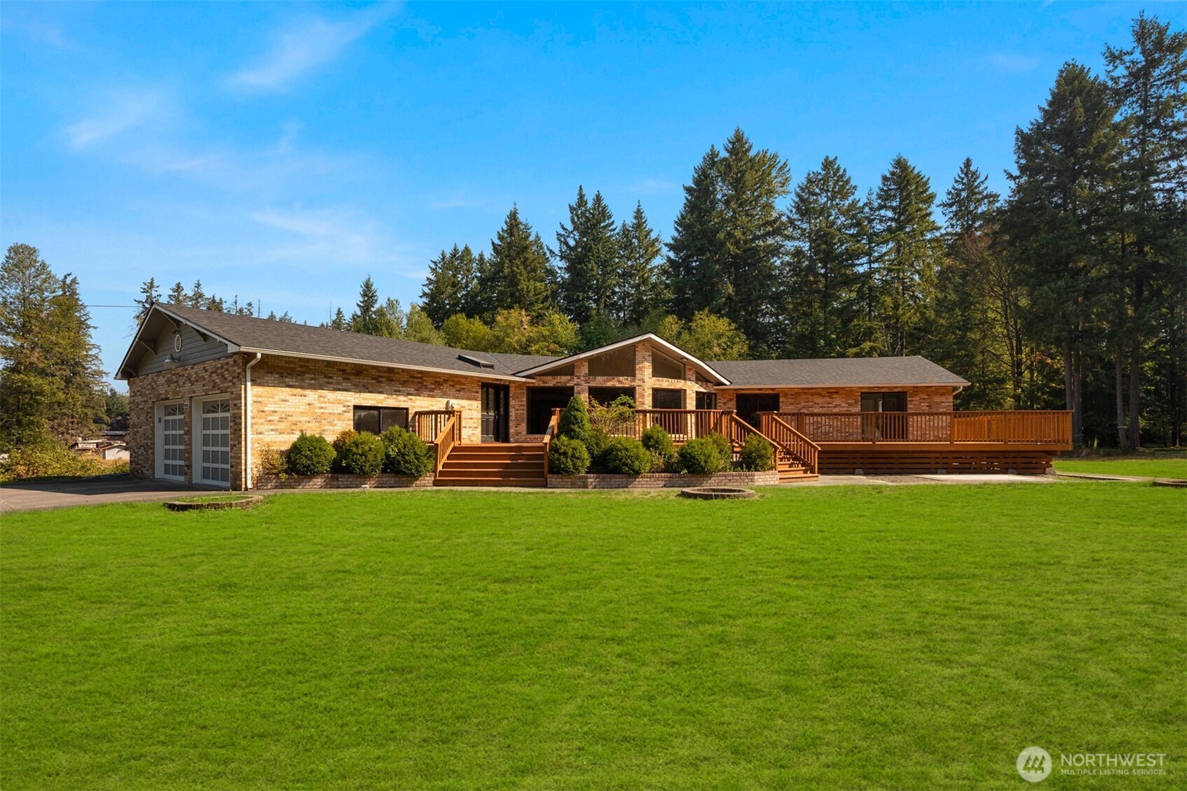 This extraordinary estate on 5+ private acres offers luxury, comfort, and incredible entertaining potential. Fully remodeled since its 1989 construction, it features a finished basement, wraparound deck, and sweeping forest views. The home includes 6 spacious bedrooms and 4 elegant bathrooms, with most rooms opening to the deck or patio for seamless indoor-outdoor living. The chef’s kitchen impresses, while the expansive living room with custom wet bar is perfect for gatherings. A dedicated theater with projector, screen, and surround sound enhances the experience. A huge shop, small horse stable, and large attached garage complete the property, making this estate both a private retreat and entertainer’s dream.