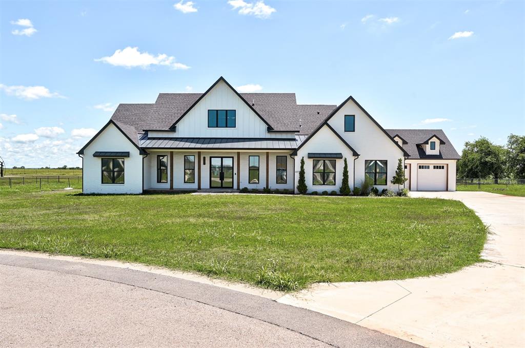 Modern ranch on 2.14 acres in Tuscan Estates, Deer Creek Schools! Built in 2023 by Highland Building Co., this 3,244 sq ft home features 3 beds, 3.5 baths, a 4-car garage, and a loft over the garage. Enjoy an oversized living room, large bedrooms with walk-in closets, and a stunning kitchen with a 10-ft island, gas range, double ovens & beverage fridge. Dedicated home office with built-ins. Wood floors throughout, tile in wet areas, and carpet only in loft. Two propane fireplaces (indoor & outdoor), covered porches front & back, and a generous portion of the backyard enclosed with black chain-link fence. Zoned gas/electric, spray foam insulation, security system, tankless water heater, sprinkler system, well, septic & buried propane. Oversized concrete driveway. HOA not yet turned over; est. $350/year. Move-in ready with space, privacy & high-end finishes throughout!