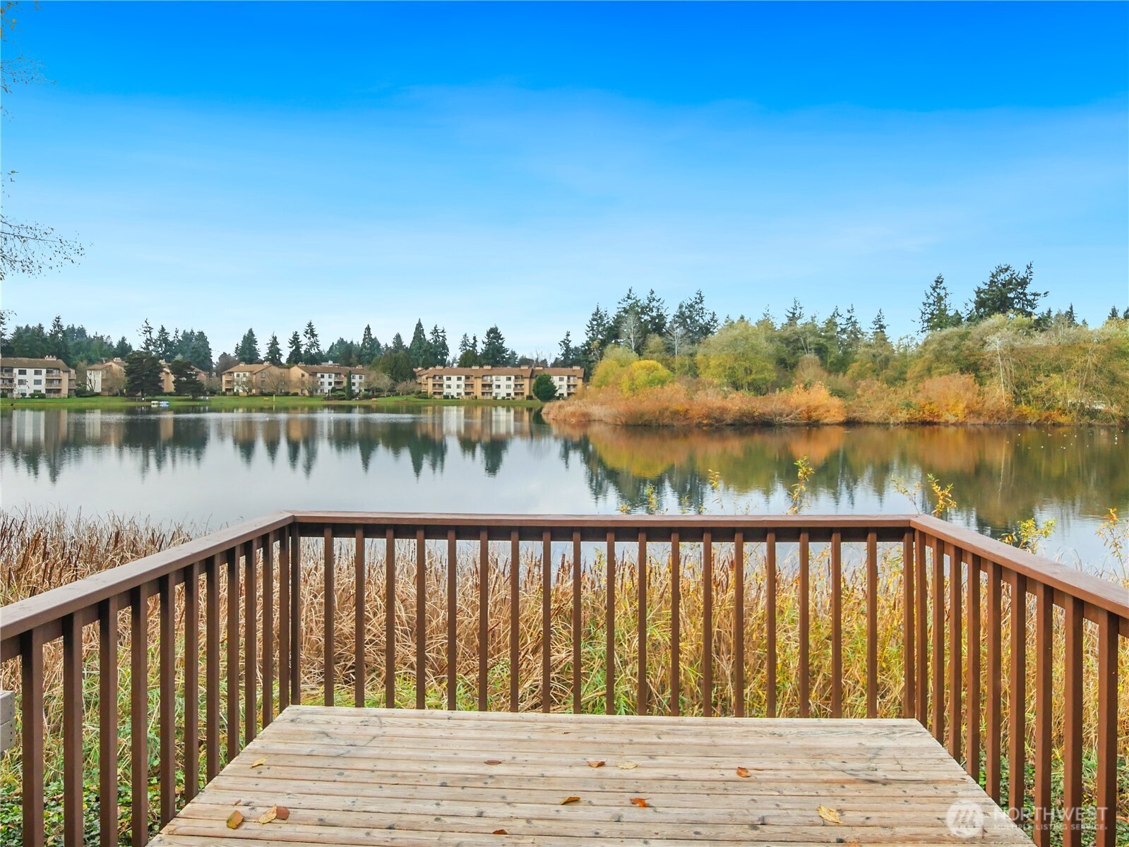 Discover your dream home on Easter Lake! REFRESHED! Hard-to-find, special 3BR, 2.5BATH townhome, lives large, like a single-family-home with 1674 sq ft. Bright & beautifully updated 2-story w/stunning lake views, a fully Renovated Kitchen with sleek quartz slab countertops, new cabinetry, large breakfast bar, new 4-pc LG SS appliances, brand new luxury vinyl plank floors, lighting, carpet, and fresh interior paint throughout. The light filled, open-concept dining/living room with cozy wood fireplace flows to spacious lakefront deck; perfect for BBQs, yoga & bird-watching. Entertain & Relax! Upstairs: retreat to serene lake views from your primary suite with a 3-pc ensuite bathroom with dual shower heads, large closet, and a private covered upper balcony! Find 2 additional, guest bedrooms & full bath - room for all! Enjoy an attached garage, ½ BA, full-size washer & dryer & ample storage for added convenience. Community Perks include a sparkling outdoor lakeside pool, low HOA, and Under Rental Cap. Tucked away; Quiet yet close to lifestyle comforts; shops, dining, parks, schools, medical centers & easy commuter routes. Claim your refreshed, lakeside gem!