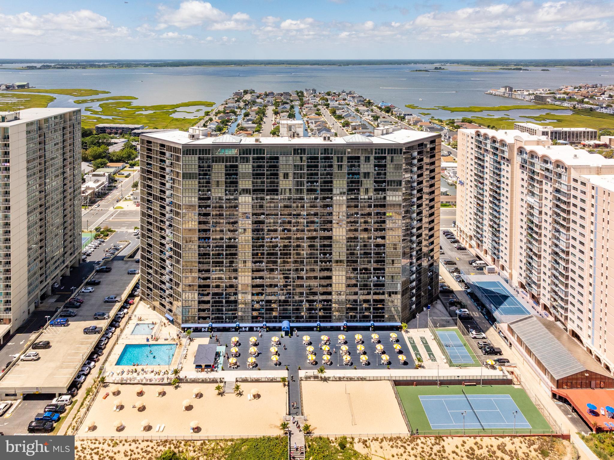 Wake up to the sound of waves and endless ocean views from this direct oceanfront efficiency unit. Perfectly positioned on the 2nd floor for easy access to all amenities, this getaway blends comfort with coastal charm. Step onto your private oceanfront balcony and take in sweeping ocean vistas, or head downstairs to enjoy a large amenity package featuring a rooftop indoor pool, outdoor pool, tennis court, and volleyball area. Inside, the unit offers easy-care tile flooring throughout and a new HVAC system (2023) for year-round comfort. Whether you’re here to relax on the beach right outside your door, play a match on the courts, or explore the nearby shopping and restaurant scene, this spot delivers the best of beach living with everything just steps away.