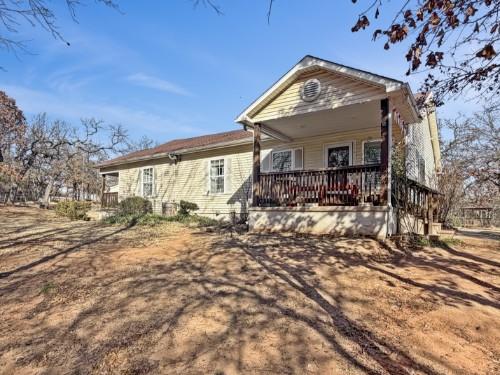 Welcome to 13207 Tatge Circle in Norman—where modern updates meet peaceful country living. This charming home has been thoughtfully and completely updated to offer today’s comfort and style. Inside, you’ll find a warm, inviting color palette, updated windows, wood-look tile flooring throughout, updated trim and baseboards, and a beautifully refreshed kitchen featuring stainless steel appliances, raised-panel cabinetry, a breakfast bar, and easy access to the deck—perfect for morning coffee while enjoying the surrounding nature.The spacious primary suite includes a custom closet system and a private bath with a tiled walk-in shower. Step outside to an additional deck just off the suite and take in tranquil views of the pond and gazebo, an ideal setting to relax and unwind at the end of the day.Outside amenities truly set this property apart, including a large underground storm shelter for peace of mind and a 20x20 workshop with power, perfect for hobbies, storage, or projects. An efficient heat pump helps keep utility costs manageable.Enjoy the serenity of country living with open space and privacy, all while being just minutes from Norman’s shopping, dining, and everyday conveniences. This unique, move-in-ready property offers charm, function, and location—an opportunity you won’t want to miss.