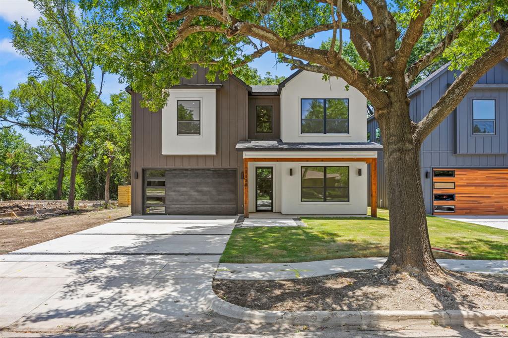 Exquisite new construction in Oak Cliff! This beautifully designed 2 story home offers 4 beds, 3.5 baths, a dedicated office, and a thoughtfully designed floor plan that blends functionality and modern living. Step inside to an impressive foyer showcasing white oak hardwood flooring in a striking herringbone pattern, setting the tone for the exceptional craftsmanship found throughout. Just off the entry, the office and powder bath create the perfect work from home space or flexible guest accommodations. The light filled kitchen is the centerpiece of the home, featuring quartz counters, single bowl sink, gas range, decorative vent hood, walk in pantry, and separate prep area with veggie sink. The kitchen flows seamlessly into the spacious living room, highlighted by a sleek linear fireplace with custom built-ins, and connects effortlessly to the dining area, creating an ideal space for entertaining. The 1st floor primary suite is a private retreat featuring a designer accent wall, ceiling fan, and abundant natural light. The luxurious ensuite bath offers quartz counter vanity, soaking tub, large walk-in shower, and an expansive walk-in closet with direct access to the oversized laundry room for added convenience. Upstairs, a spacious game room or second living area with a wet bar provides endless possibilities for entertaining, relaxing, or accommodating your family's lifestyle. Two generously sized secondary bedrooms share a well-appointed hall bath, while the fourth bedroom enjoys the privacy of its own ensuite bath and large walk-in closet. Thoughtfully designed with contemporary finishes, designer details, and quality craftsmanship throughout, this home delivers both style and comfort in every space. Outside, enjoy a covered patio overlooking the oversized backyard, which offers plenty of room for an in-ground pool, outdoor kitchen, or future backyard oasis. The side yard provides additional flexibility for expanded driveway parking or customized landscaping.