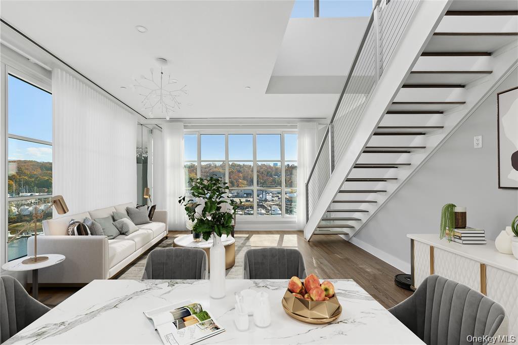 Exceptional Waterfront Penthouse. Experience luxury waterfront living in this exceptional penthouse corner residence at The Beacon at Garvies Point, showcasing breathtaking water views from every window overlooking Hempstead Harbor, the surrounding waterways, and the community pool.Floor-to-ceiling windows frame spectacular marina views, filling the expansive living room with natural light. The open-concept layout flows seamlessly into a chef’s kitchen featuring top-of-the-line appliances, sleek finishes, and abundant storage. A gracious foyer, well-appointed powder room, and dedicated laundry area add to the home’s thoughtful design and convenience.The primary suite offers a serene retreat, complete with an en-suite bath and walk-in closets. Private balcony off primary suite.  The highlight of this remarkable residence is its expansive private rooftop terrace, where panoramic marina and water views create the perfect setting for entertaining or relaxing in your own private oasis.Additional amenities include a separate storage unit, two parking spaces, a private EV charger, and a water-view fireplace.Don’t miss this rare opportunity to own a premier waterfront corner penthouse with a spectacular private rooftop terrace and truly extraordinary views.