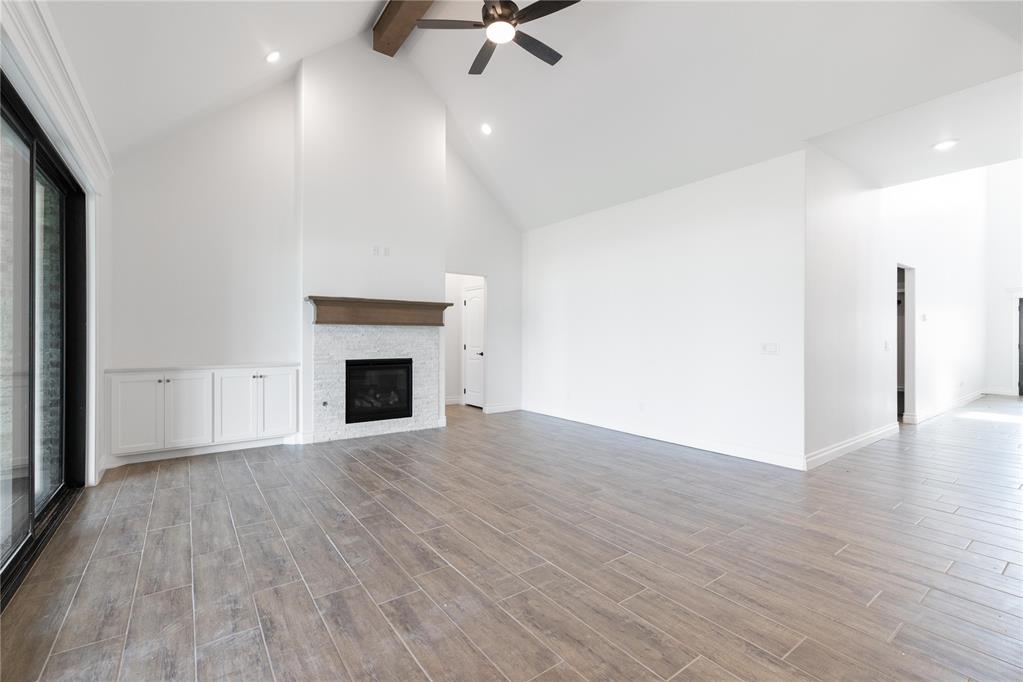 This Korbyn floor plan includes 3,895 Sq Ft of total living space, which includes 3,625 Sq Ft of indoor living space and 270 of outdoor living space. There is also a 690 Sq Ft, three-car garage with an in-ground storm shelter installed. This home offers 5 sizeable bedrooms, 4 full bathrooms, a half bath, 2 covered patios, an In-Law/guest suite, a mud area, a utility room, and a generous bonus room. Pass the covered front porch and the dual height entry lies the ultimate floor plan. The great room embraces wood-look tile, a spectacular cathedral ceiling with a ceiling fan, a luxurious 3-panel sliding door with a 4' back patio extension, rocker switches throughout, and a gas fireplace finished with our stacked stone detail and built-in lower cabinets on one side. The great room opens to the kitchen and boasts an oversized center island with a trash can pullout installed, custom-built cabinets to the ceiling with pulls only cabinet hardware throughout and under cabinet lighting, 3 CM countertops, a HUGE walk-in pantry, stainless steel appliances, including double ovens and a 5-burner cooktop, adorning tile backsplash, stunning pendant lighting, and ample storage opportunities. The secluded primary suite features windows, our cozy carpet finish, a ceiling fan, and our sloped ceiling detail. The primary bath features a European walk-in shower with a full-length shower bench, a separate sink vanity concept, a free-standing tub, a private water closet, & one massive primary closet (partition wall has been removed). Bedroom #2 lies towards the front of the home and spotlights an In-Law/guest suite set up with a walk-in closet included. The second level holds the bonus room, a full bath, a Jack and Jill bath, and bedrooms #3, #4, and #5. Outdoor living supports a corner wood-burning fireplace, a gas line for your grill, and a TV hookup. Other amenities for this home include a tankless water heater, an air filtration system, a fresh air ventilation system, and so much more!
