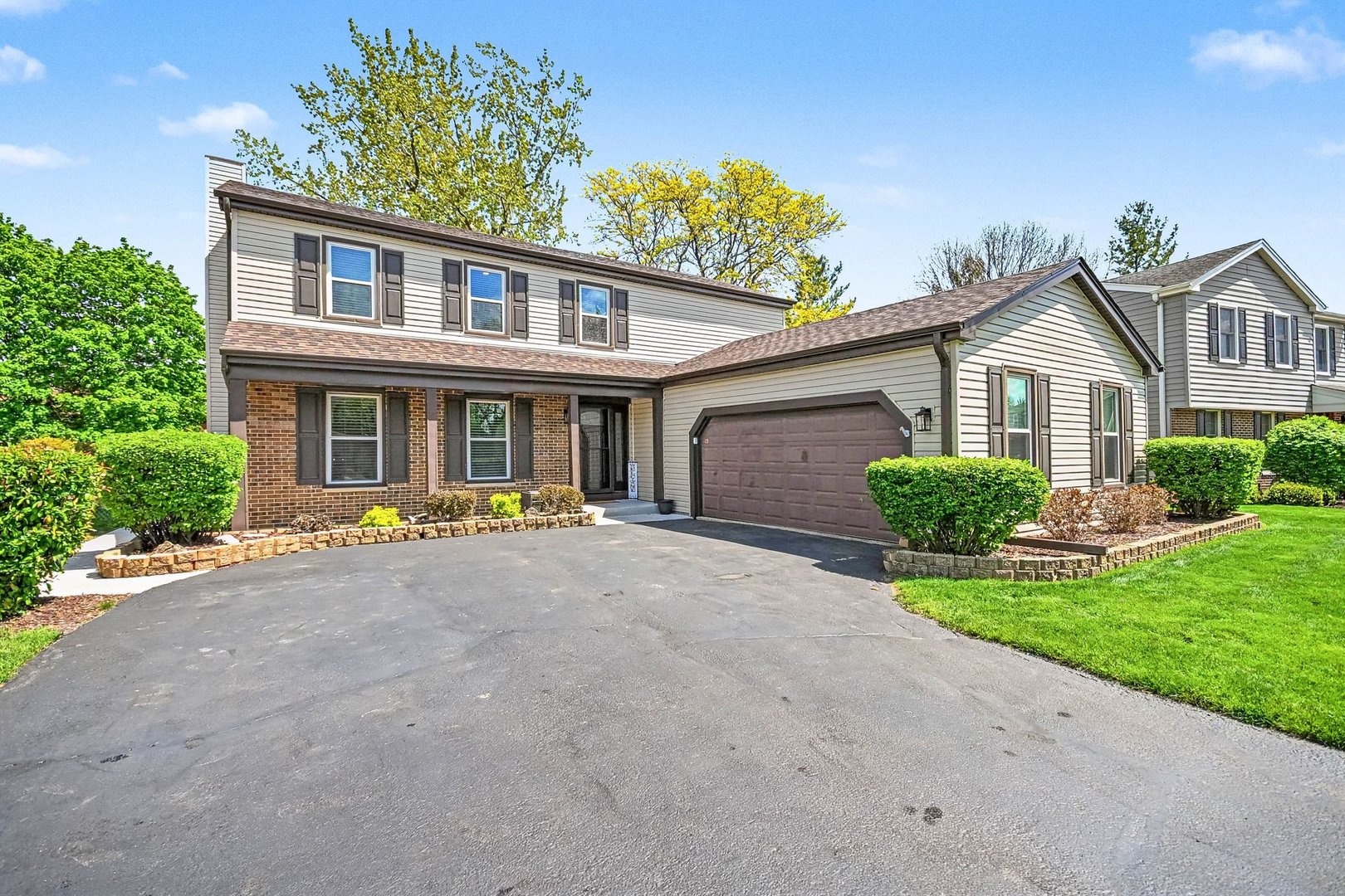 Sought-after Chesapeake Landing home with great curb appeal and highly rated Districts 12 and 108, including Lake Park High School. Move-in ready with a center island kitchen, stainless appliances, newer flooring & paint.  Spacious primary suite offers a walk-in closet and updated bath. Generous secondary bedrooms with abundant closet space. Finished basement features a bar area, rec room, and office or exercise room. Conveniently located near train, schools, shopping, library, and more. Furnace 2012, AC 2014, Roof & Siding 2025.