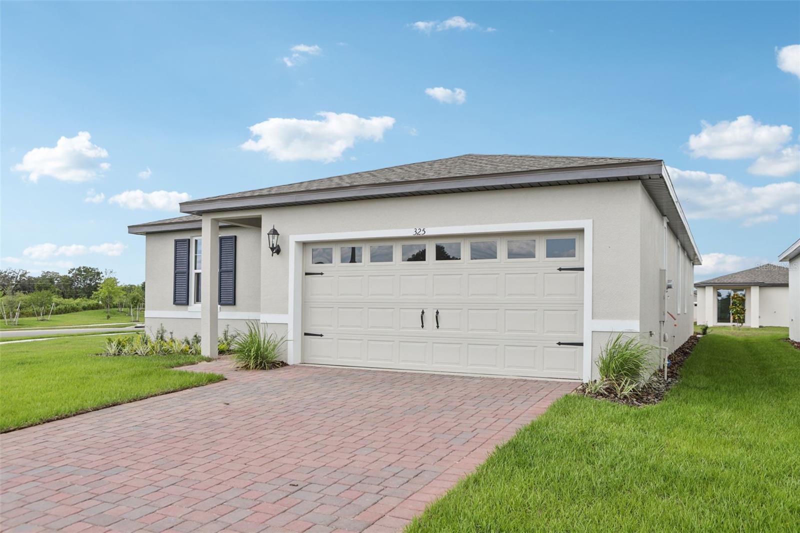 Brand NEW energy-efficient home ready NOW! No rear neighbors and no neighbors on left side of house. Configure the flex room in the front of the home to an at home office space or hobby space. Past the foyer, the open kitchen flows to the dining space, great room and outside patio. Private primary suite offers a spacious area to relax. Now selling from the high $200s, Springs at Lake Alfred offers new single-family homes in Polk County. This community is conveniently located right off of I-4 and will feature an abundance of amenities including a pool and cabana, walking trails, a sports field, parks, and a tot lot. Right down the road, Downtown Auburndale features a beautiful city park, playground, and local eateries. Each of our homes is built with innovative, energy-efficient features designed to help you enjoy more savings, better health, real comfort and peace of mind.