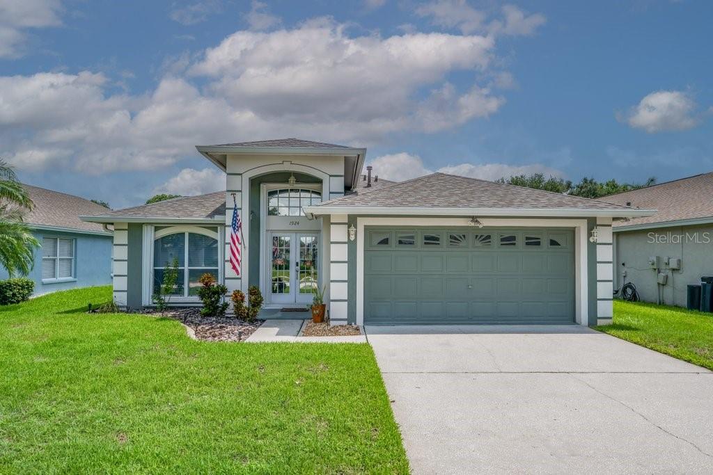 GORGEOUS UPDATED POOL HOME // PHENOMENAL LOCATION! Nestled within the established Peppermill neighborhood of Providence Lakes, this exceptional 3-bedroom, 2-bath saltwater pool home has been thoughtfully updated from top to bottom, offering the perfect combination of style, comfort, and peace of mind. From the moment you enter, you'll appreciate the spacious, light-filled living room where French doors open to a screened lanai designed for year-round Florida living. The outdoor space is an entertainer's dream, featuring a sparkling saltwater pool, a covered bar complete with a sink and mini fridge, and plenty of room to relax with family and friends. The private primary suite serves as a true retreat with direct patio access, a custom walk-in closet, and a beautifully renovated ensuite bath. A desirable split-bedroom floor plan provides privacy for family or guests, while one secondary bedroom has been enhanced with custom built-ins, making it an ideal home office or flex space. The updated kitchen is both beautiful and functional, featuring KitchenAid stainless steel appliances, including the stove, dishwasher, and microwave, along with a 2025 GE French-door refrigerator with an interior water dispenser, custom pantry, cozy breakfast nook, and formal dining room overlooking the backyard. Extensive recent improvements make this home truly move-in ready, including a new roof (2025), interior paint (2025), whole-house Aquasana water softener (2026), HVAC system (2021), water heater (2020), pool pump (2025), hurricane shutters, MyQ-enabled garage door opener, Hayward suction pool cleaner, sump pumps, garage workbench, and steel garage shelving. Ideally located just minutes from Topgolf, iFLY, Brandon Town Center, Target, shopping, dining, and entertainment, with convenient access to MacDill Air Force Base and Tampa International Airport, this meticulously maintained home delivers the Florida lifestyle you've been waiting for—where every major update has already been completed and all that's left to do is move in and enjoy.