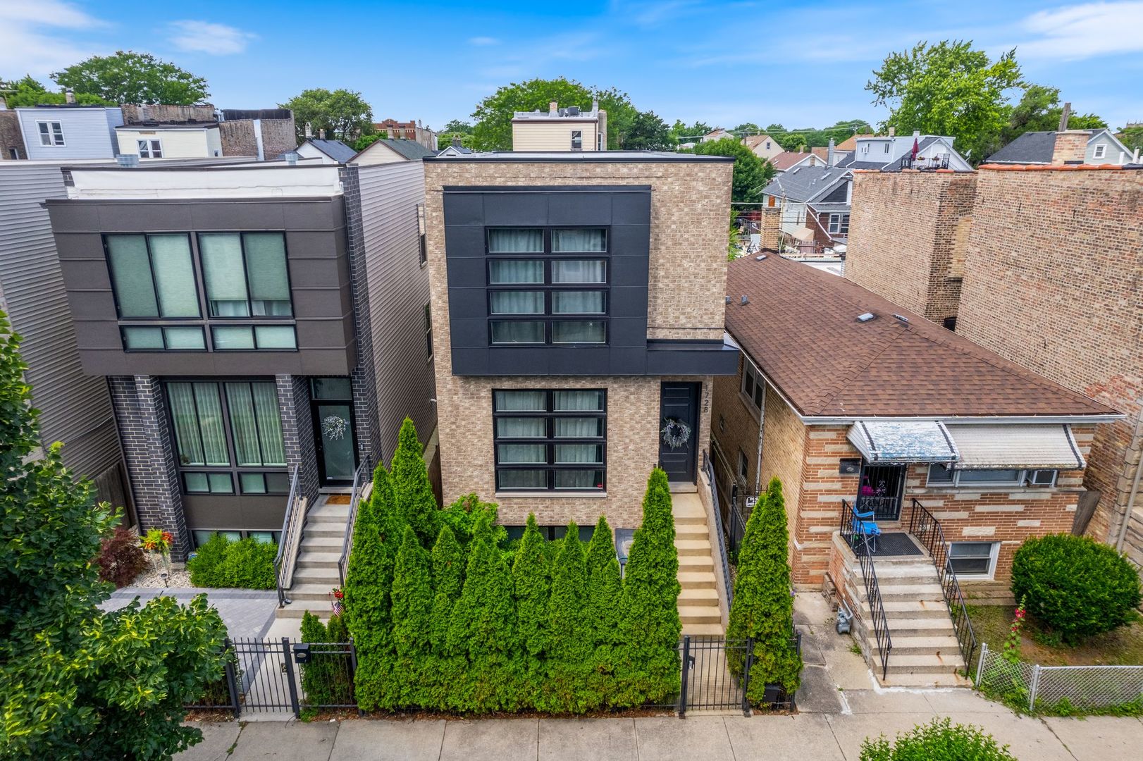 Impeccable custom built modern and spacious Logan Square single home just steps from the highly desired 606 Trail. This meticulously refined contemporary home offers elegance and functionality. Featuring a sleek brick facade, soaring ceilings with recessed LED lighting throughout the house, natural oak wood flooring, modern staircase with additional built in LED lighting, custom kitchen cabinetry, high end appliances. Large island with breakfast bar seating and large eat-in kitchen dining space. Custom designed powder room. Upstairs offers a large primary bedroom and separate walk-in closet with custom remodeled primary bath and invigorating shower jets. Upstairs also boasts two additional bedrooms with newly remodeled Jack-and-Jill bathroom and a second-level laundry hookup. Bright lower level will impress with lots of storage space, wet bar with beverage fridge in the family room area, additional guest full bathroom, and a huge, oversized bedroom. Lower level also provides a laundry room in addition to the upstairs laundry hookup. Located in a vibrant area of the city with lots of cafes, restaurants, and music venues. Make this your dream home!