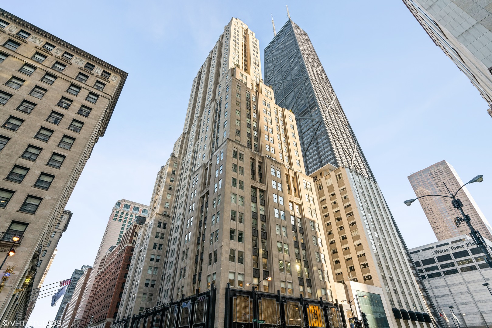 Welcome to the Palmolive Building, one of Chicago's most iconic addresses. This one-bedroom, one-and-a-half-bathroom home at 159 E Walton Place, Unit 6B, is the ideal mix of classic elegance and modern convenience. Whether you're looking for a refined city escape or a full-time home, this residence delivers. The layout is smart and efficient, with high ceilings, large north-facing windows, and wide-plank oak floors throughout. The kitchen features high-end appliances, a new washer and dryer, and custom-built closets that maximize space without sacrificing style. The primary suite includes a beautifully finished bathroom with a separate tub and shower. Deeded valet parking is included.    Residents enjoy world-class amenities, including concierge service with mobile app integration, a private gym and spa, and access to the Beacon Club, an exclusive resident lounge and entertainment space. Just outside your door, you're steps from the lakefront path, Oak Street Beach, and the best dining and shopping in the Gold Coast and along Michigan Avenue. Unit 6B offers a rare chance to live in a full-service building with unmatched character and location.
