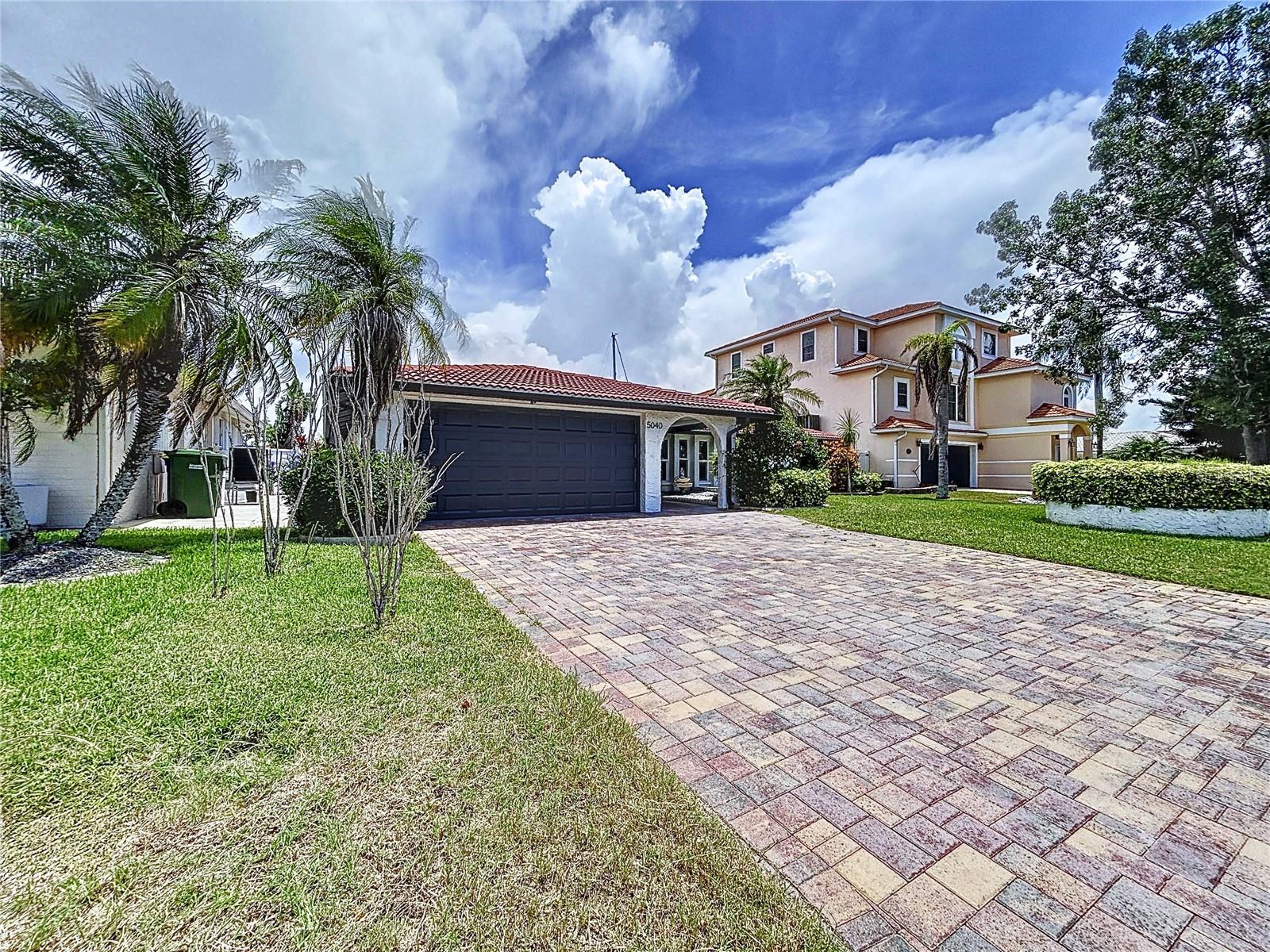 Waterfront Living in Gulf Harbors – Fully Remodeled & Move-In Ready!Welcome to 5040 Glenn Dr., a beautifully renovated waterfront home located on a deep-water canal in the highly desirable Gulf Harbors community. This exceptional property is being offered with a transferable flood insurance policy of approximately $5,000 annually — a significant savings compared to many other waterfront homes in the area.This stunning 4-bedroom, 3-bathroom home has been completely remodeled and offers the perfect combination of luxury, comfort, and true Florida coastal living. From the moment you enter, you're welcomed by breathtaking water views and a bright, open-concept layout that seamlessly connects the living room, dining area, and kitchen—ideal for both entertaining and everyday living. Large windows and thoughtful design maximize natural light while showcasing the peaceful canal setting just beyond your backyard.Boating enthusiasts will love the deep-water canal with direct Gulf access, making this home a true boater’s paradise. The property features a private dock with boat lift, allowing you to step outside and head straight to the Gulf. Spend your days relaxing by the sparkling pool and spa, then unwind in the evening while enjoying tranquil waterfront sunsets.The home has been fully remodeled with all improvements completed under permit. Recent upgrades include new electrical and plumbing systems, brand-new windows, luxury vinyl plank flooring throughout, and a modern kitchen featuring quartz countertops. Additional highlights include multiple indoor living and sitting areas, a dry bar overlooking the pool, beautifully updated bathrooms, and two spacious primary suites, offering flexible living arrangements for guests or multi-generational needs.Additional features include:Split-bedroom floor plan for added privacy2-car garage with new garage doorFully updated interior throughoutGolf cart–friendly, deed-restricted communityGulf Harbors residents have optional access to the private beach club, featuring a pristine sandy shoreline, 21 pavilions, charcoal grills, restrooms, and one of the best sunset views in the area. Annual membership is just $200 a year.Residents may also choose to join the Gulf Harbors Civic Association for $125 a year (optional), which includes access to a variety of clubs such as the Women's Club, Card Club, Fishing Club, Social Club, and more—along with access to two private community boat ramps.Conveniently located just 3.2 miles from historic downtown New Port Richey, you'll enjoy easy access to Sims Park, local restaurants, breweries, festivals, and entertainment. The home is also close to major highways, nature preserves, boat ramps, shopping, and dining.This property truly offers the complete waterfront lifestyle — schedule your private showing today.