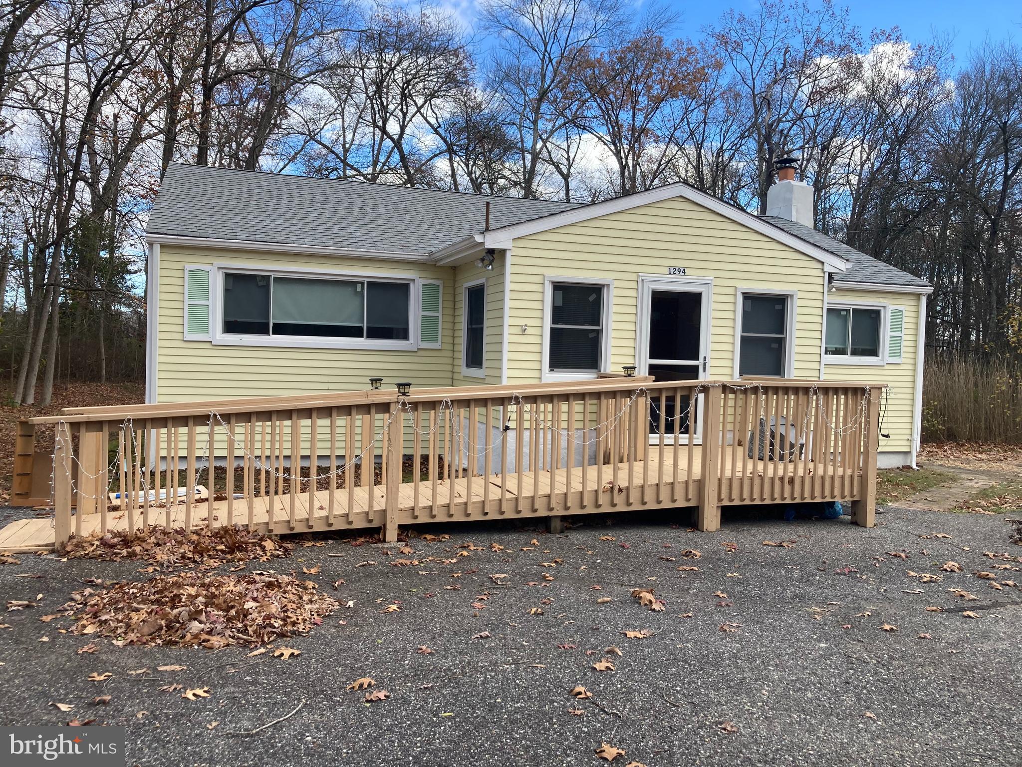 Updated ranch conveniently located  on route 206. There are 3 nice sized bedrooms and one full bath.  The front porch has been enclosed and can be used as office, den or bonus room. Major systems that have been updated include roof, interior paint,  and a new septic system.  A nice , bright country kitchen make meals a pleasant dining experience. There are Six panel doors, new front storm door and a new kitchen door is on order and will be installed soon. Washer and dryer are located in a separate utility room entered from the deck. The house is being conveyed with the lot at 1292 Route  206 . Easy to show make your appointment today. Fireplace is wood burning, seller has never used and is in AS IS Condition.  Buyer inspections for information purposes only and house is being sold As Is .