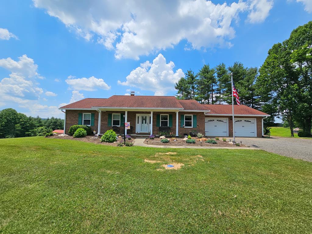 This immaculate brick ranch home offers the perfect blend of comfort, functionality, and breathtaking natural beauty, situated on 9.4+/- mostly cleared acres directly across from the scenic Blue Ridge Parkway. With stunning mountain views and just steps from the Stewarts Creek Wildlife Management Area, the Music Center, and endless outdoor recreation, this 3-bedroom, 3-bathroom home is clean as a pin and move-in ready. The main level features new vinyl plank flooring in the living areas and an updated kitchen with sleek quartz countertops. A finished basement adds extra living space with a large den, second kitchen, and full bath—ideal for guests or multi-generational living. Additional upgrades include a new heat pump installed in 2023, central vacuum system, and a whole-house generator for peace of mind. Step outside to enjoy a covered back deck overlooking beautiful open pastures, a firepit, and extensive landscaping. The property includes multiple sheds and outbuildings, a 3-stall barn, RV storage, 2-50amp hookups, water and septic tank, and a flowing creek—making it nice for livestock or simply enjoying serene country living at its finest. Call Today!