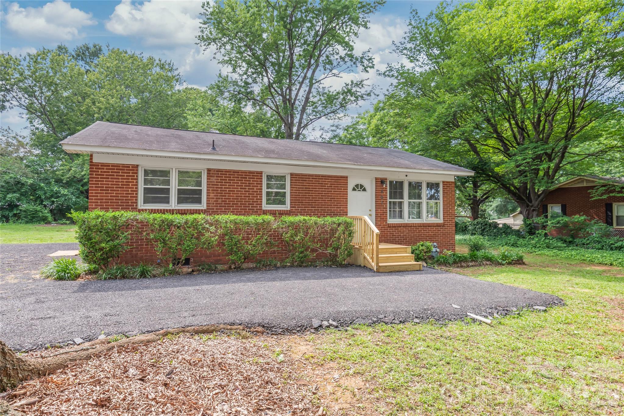 Fresh and move-in ready, this nicely renovated 2-bedroom brick ranch sits on a nearly half-acre lot and offers a spacious split-bedroom floor plan with the bathroom conveniently positioned between the bedrooms. Updates include new LVP flooring throughout the kitchen, dining, and living areas, new cabinetry and countertops, and a refreshed bathroom. Outside, you'll find a new asphalt parking area and entry, a large flat backyard with loads of potential for gardening, recreation, or future improvements, plus a storage building for added convenience. A great opportunity to own an updated home with room to grow.