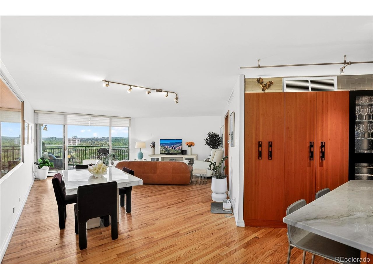 *High End Finishes*  *Views*  *Location*  *Luxury*  This unit's stunning high-floor, south-facing views include Pikes Peak, Cherry Creek, and our beautiful Colorado mountains. You'll love everything about this 17th-floor unit, from its high-end finishes to the in-unit washer and dryer. And you'll love everything about Penn Square, from 24/7 onsite management to its spectacular amenities - outdoor pool - gazebo - fitness room - private guest suite - community party rooms - and rooftop garden.  A complete kitchen remodel features high-end Dacor and Miele appliances, two-tone custom cabinetry, beautiful quartz counters, a full pantry system, and room for bar stool seating. Come home and unwind in the in-unit luxurious steam shower, then enjoy all the other high-end features of the remodeled bathrooms-premium fixtures, fresh tile, and beautiful stone flooring. Storage abounds-an entire wall of closets in the primary suite, walk-in closets, floor-to-ceiling cabinets throughout, a dedicated storage unit on level B1, and an oversized garage space on level B2. The RTD bus stops just feet from the building, and with a walk score of 93, you can walk everywhere-shops, restaurants, grocers, Cheesman Park, and more. With 24/7 on-site management, Penn Square is one of the high-rises in Denver. See it now!