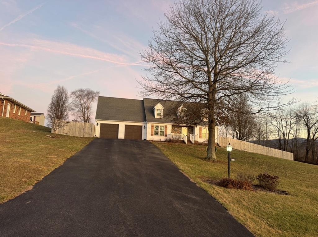 Located in a highly desirable neighborhood, this beautifully updated 3-bedroom, 2-bath home offers the perfect blend of modern upgrades and comfortable living, all set on a .61-acre lot.  Inside, you'll find new hardwood flooring throughout, complemented by elegant crown molding and updated fixtures that add a refined touch. The renovated kitchen features soft-close cabinetry, newer appliances, and a functional layout ideal for everyday living and entertaining.  The primary bedroom on the main level offers convenience and privacy with dual closets, while a dedicated office on the main floor provides flexible work-from-home space. Upstairs features two additional bedrooms and a full bath. There is ample storage in both attics. Outside you'll find a Trex back porch and a retractable awning, perfect for relaxing or hosting guests. Additional highlights include two new garage bay doors, a full-house generator, whole-home surge protection, and a septic system pumped two years ago for added peace of mind. This move-in-ready home offers quality updates, thoughtful design, and space to enjoy—an excellent opportunity in a sought-after location.