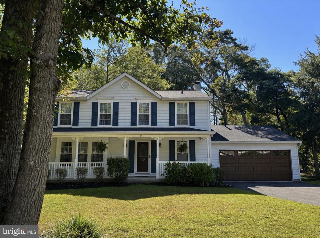 Welcome to desirable Kings Grant in Marlton with 400 acres of private natural open space, wooded trails, lakes and ponds for use by Association members. This natural backdrop is a beautiful place to live, hike, and kayak.  Conveniently located within the community is an elementary school, golf course, clubhouse, beach and shopping center which are extremely convenient and fun!This spacious 4-bedroom, 2.5-bath home offers the perfect blend of modern updates with a classy feel! Step inside to find brand-new light luxury vinyl flooring throughout the living room, family room and open kitchen giving a fresh, updated feel. A fireplace w gas insert for convenience anchors the family room, making it a cozy spot to gather on cooler evenings. The kitchen has a centrally located island which is a perfect spot to hang out. Formal dining room off the kitchen for holiday dinners. Large laundry closet and half bath complete this lower level.Upstairs, you’ll find the main bath newly updated and four generously sized bedrooms, including a primary suite with its own updated private bath. The home also features a new roof and a tankless water heater, offering both peace of mind and energy efficiency.Outside, enjoy a double-deck setup out back that’s perfect for hosting summer get-togethers. The front porch is calling your name for a relaxing morning coffee. The two-car garage includes a brand-new garage door, adding both convenience and curb appeal. The sellers took great pride in maintaining this home!