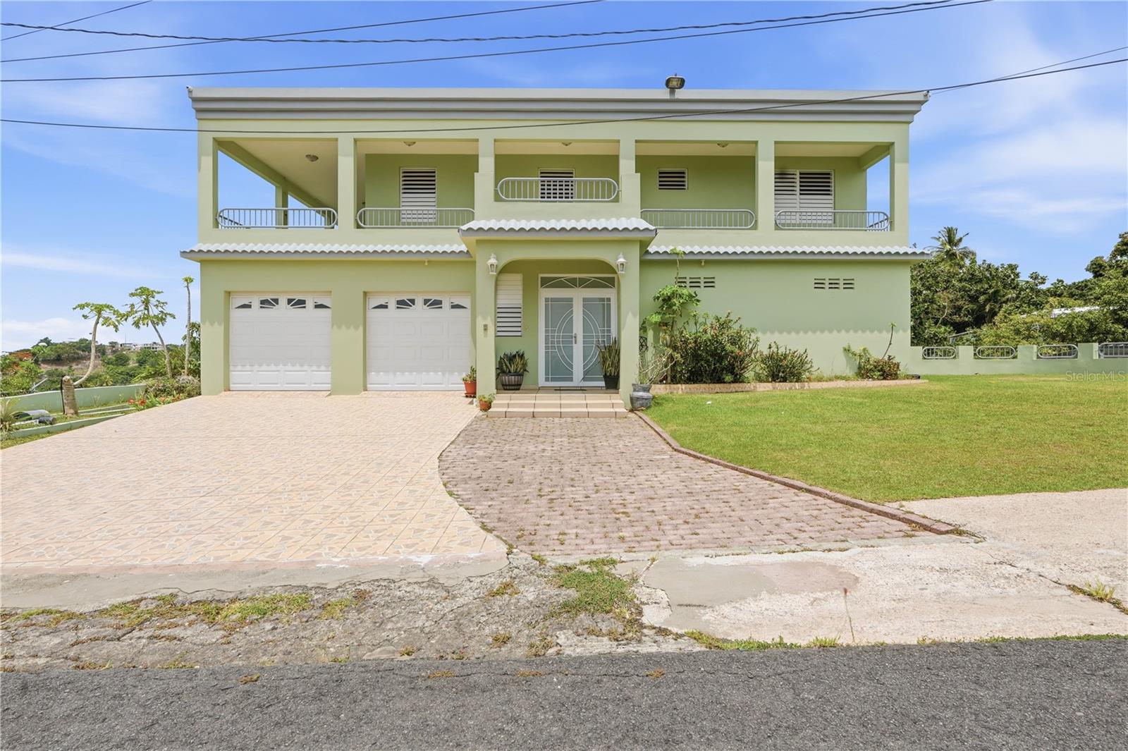 THE PROPERTY EVERYONE WANTS IN BAYAMÓN IS NOW AVAILABLE!If you've always dreamed of living surrounded by nature, privacy, and breathtaking views... this is the opportunity you've been waiting for.Los Torres Sector, Minillas Neighborhood, Bayamón, Puerto RicoImagine waking up every morning to a spectacular view of northern Puerto Rico, breathing fresh air, and enjoying the tranquility that only a cul-de-sac. Here, you're not just buying a house... you're investing in a new lifestyle.Key Features:Approximately 2,646 square feet of construction.2,312.06 square meter lot.Built around 2005.3 spacious bedrooms.2 full bathrooms.2 half bathrooms.Large office with walk-in closet and half bathroom, easily convertible into a 4th bedroom.Indoor laundry room.Inviting L-shaped balcony with stunning panoramic views. Carport for 2 vehicles and additional space for at least 3 more.A yard that feels like a private estate...Enjoy fruit trees planted right on your property: Avocado, Breadfruit, Annatto, Maví, Cinnamon, Guava, Mango, and Plantains.In addition, the property features a huge basement storage area, the same length as the house, ideal for storage, a workshop, or future projects.Ready for anything: 12-panel solar system with backup batteries. Solar water heater. 15 kW diesel generator. Approximately 500-gallon cistern. Three air conditioners. Freshly painted and move-in ready.There are nice houses... There are big houses... And then there's this property, where every corner was designed for enjoying life, sharing with family, and taking in one of the most beautiful views in Bayamón.
