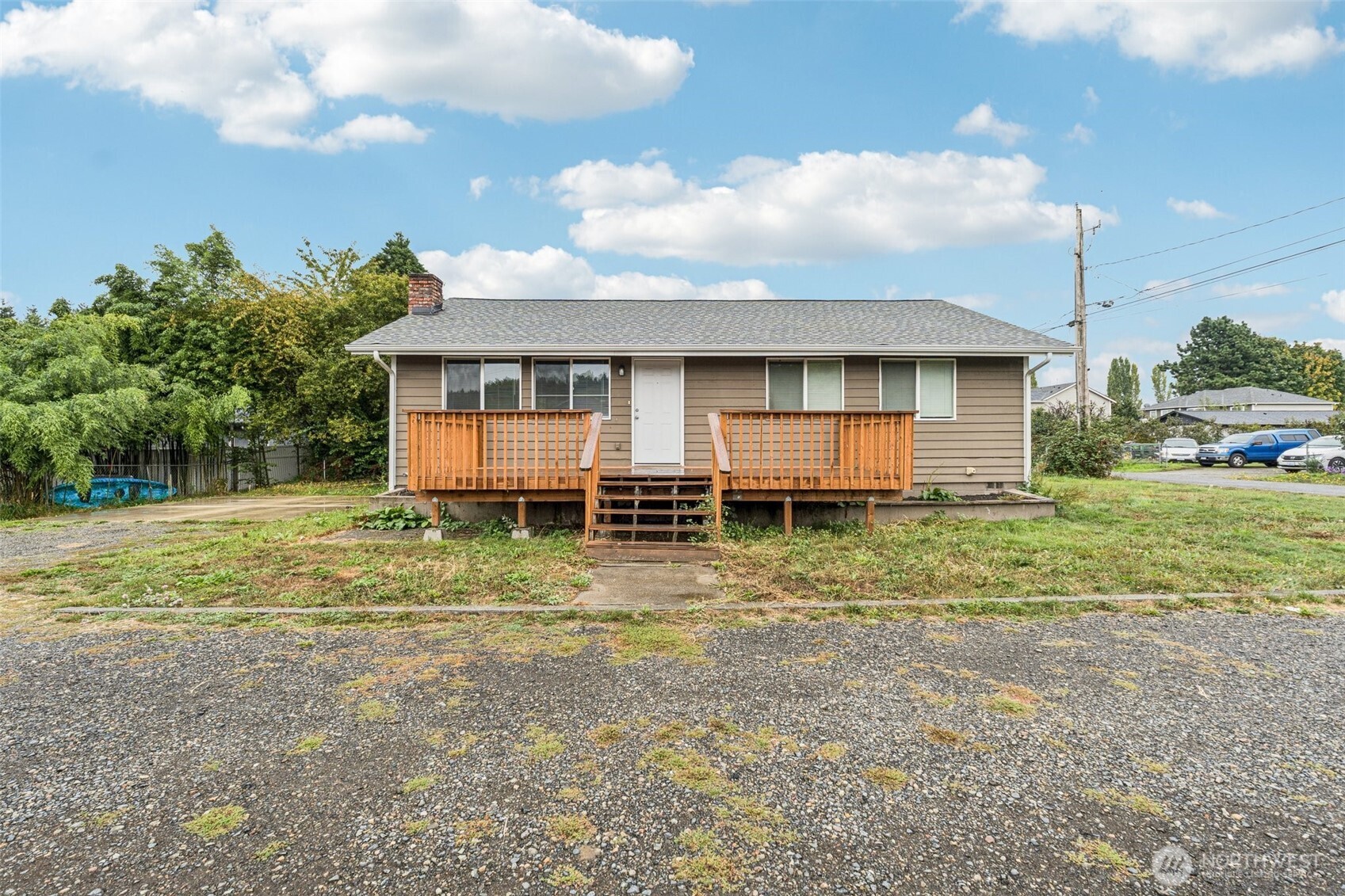 This beautifully updated home offers the perfect balance of comfort and convenience. With 3 spacious bedrooms and 2 remodeled bathrooms, including an oversized primary suite with en-suite bath. With an open-concept kitchen and large living room this home has been designed for modern living.  Step outside to enjoy the 8000 square foot lot and spacious deck ideal for entertaining or simply unwinding at the end of the day. Enjoy the large yard with a spacious deck and off-street parking.  Nestled in a quiet neighborhood just off 15th St., with quick access to SR 167, Hwy 18, and I-5. Award-winning schools, shopping, and dining are all just minutes away. Don’t miss this home with tons of updates and a welcoming community feel.