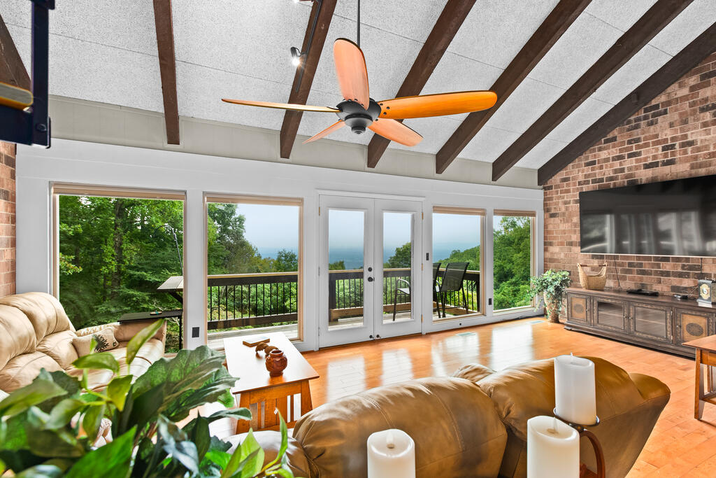 Property is under contract with a contingency kick-out clause. The property remains available for showings & interested buyers may submit an offer. This beautifully updated 2-bedroom, 2-bath condo in Groundhog Mountain offers a unique combination of character, updates & breathtaking views. Located just off the Blue Ridge Parkway, this mountain retreat puts you close to the beauty of the Blue Ridge Mountains while still being convenient to Hillsville, Fancy Gap, Floyd & Mount Airy. Step inside & you'll immediately notice the beautiful exposed brick that adds warmth & character throughout the living space. The updated kitchen features new cabinetry, granite countertops & stainless-steel appliances, including a dishwasher, electric cooktop, wall oven, microwave & refrigerator. Large windows bring the incredible mountain views indoors, while the deck provides the perfect place to sit back & enjoy the scenery. A spiral staircase leads to a versatile loft area, along with a small adjoining room that would make a great children's room, office, hobby space or additional storage. The primary bedroom features a completely updated ensuite bathroom with new vanity, granite countertop & tiled shower, while the second completely updated bathroom with new vanity, granite countertop and tiled shower w/ glass enclosure is conveniently located off the hallway. A crawl space provides additional storage. And for those who truly value a view, an additional vacant lot located below the condo is also available for purchase, giving you the opportunity to help protect your spectacular mountain views for years to come. The HOA includes water, sewer & exterior maintenance & insurance, along with access to the community's tennis court, pickleball court, fishing pond & community building. Ground Hog Mountain offers easy access to the Blue Ridge Parkway & the outdoor recreation, scenic drives & mountain destinations that make this area so special.