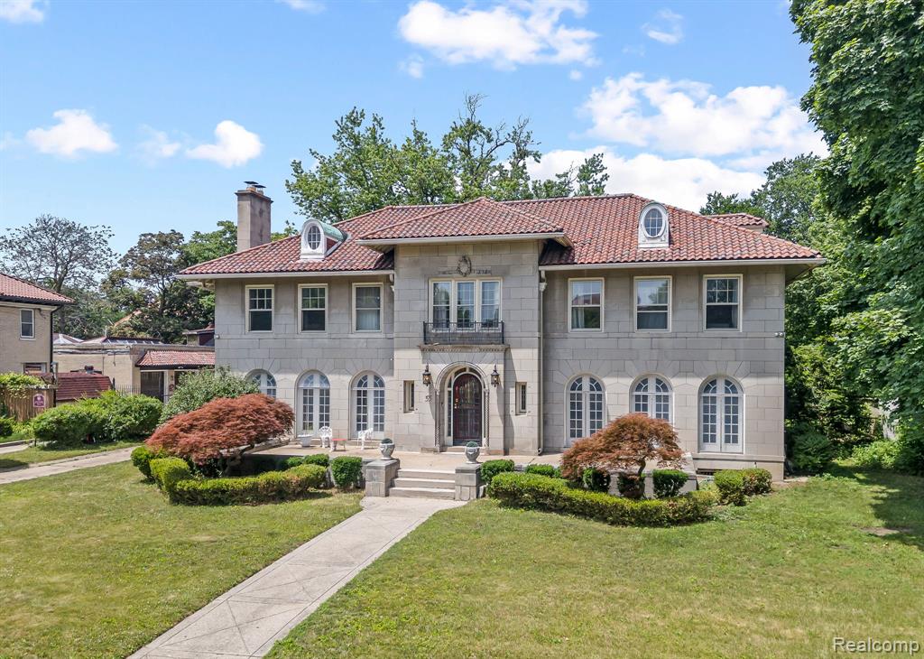 Step into a rare architectural masterpiece in the heart of Historic Boston-Edison. Designed by the acclaimed firm Milder & Eisen for Henry R. Mazer and built in 1924, this grand Limestone Mansion radiates timeless elegance, artistic heritage, and impeccable craftsmanship.

A true creative sanctuary, the home has been graced by renowned artists including James Allen Jones and Wes Borland of Limp Bizkit. Under Borland’s ownership, the mansion underwent thoughtful renovations that seamlessly married historic charm with modern sophistication. The current owners have lovingly continued this legacy, preserving the home’s exquisite original details while enhancing livability for today's standards.

This expansive residence features seven spacious bedrooms, including a hidden bonus room and private au pair or in-law quarters. Four full bathrooms and two half baths have been beautifully updated with an eye for both function and design. Sunlight pours into the home's expansive sunrooms, creating bright, inviting spaces that are ideal for both relaxing and inspiring creativity. The elegant formal dining and living rooms are adorned with ornate architectural detailing, making them perfect for entertaining. Throughout the home, lovingly preserved original elements—including hardwood floors, intricate moldings, and period fixtures—speak to its rich history and enduring beauty.

Set on a stately lot with mature landscaping, this home offers a rare opportunity to own a piece of Detroit’s architectural and cultural history. It is an ideal haven for collectors, creatives, and connoisseurs of classic design. Don’t miss your chance to own one of Boston-Edison’s most iconic residences. Schedule your private showing today.