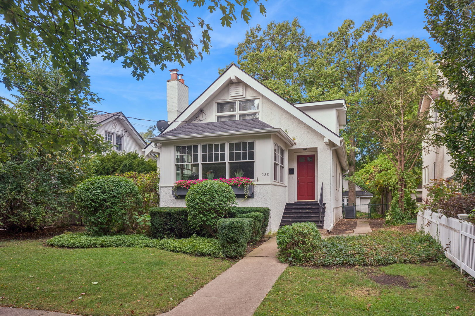 This bright and expanded east Winnetka bungalow is move-in ready and larger than meets the eye! It's a spacious 4-bed, 3-bath home with a main floor that features a large and sunny living room, separate dining room, updated eat-in kitchen, two bedrooms and a full bath. The sizeable second-floor primary bedroom has a sitting area where you can enjoy the treetop views. The sunny bathroom on this floor is complete with Carrara marble counters, two sink areas and a skylight. The second upstairs bedroom comfortably fits 2 twin beds or can be converted to an office or enormous walk-in closet to create a primary suite. Escape to the full, finished basement complete with multi-use rec room with built-in cabinets, a full bath, a laundry room with utility sink, table and storage. Easy exterior access from the basement and the kitchen to the fully fenced backyard shaded with oak trees, a charming brick paver patio, an architect-designed 2-car garage with windows and a window box and a perfectly sized yard. The garage attic serves all of your overflow storage needs and is accessed by pull down stairs. This lovely home is ideally located near Greeley Elem (2 blks), New Trier HS (4 blks), Metra (2 blks), park/playground (2 blks), Elder Beach (5 blks), and downtown (9 blks).