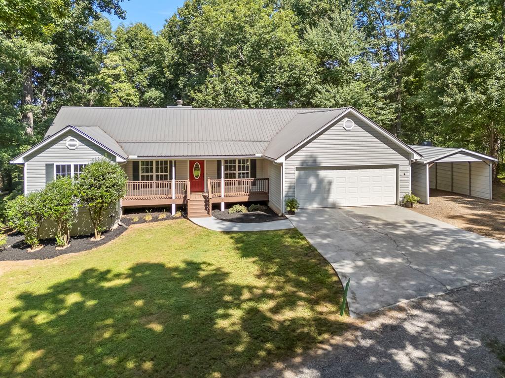Welcome to Your Mountain Oasis at 311 Deerwood Trail Road, Blairsville, GA! Discover the perfect blend of modern luxury and serene mountain living in this fully renovated 3-bedroom, 2-bathroom single-level home with a versatile study, nestled in the heart of Blairsville. Just minutes from Lake Nottely and conveniently close to town, this stunning residence offers accessibility, comfort, and endless possibilities for families, retirees, or anyone seeking a peaceful retreat.Step inside to find all-new flooring, designer lighting, and a gourmet kitchen that's a chef's dream, complete with sleek countertops, modern cabinetry, and brand-new appliances. The open-concept living area flows effortlessly, creating a warm and inviting space for gatherings. The master suite is a true sanctuary, boasting an exquisite tiled shower that elevates your daily routine to a spa-like experience.Outside, a fenced-in backyard provides a safe haven for pets, play, or relaxing under the stars, surrounded by the beauty of the North Georgia mountains. With its accessible layout and thoughtful upgrades, this home is move-in ready and designed for easy living.Whether you're dreaming of cozy mountain evenings, outdoor adventures on Lake Nottely, or a forever family home, 311 Deerwood Trail Road delivers it all. Don't miss your chance to own this gem—schedule your tour today and start living the mountain life you've always imagined!