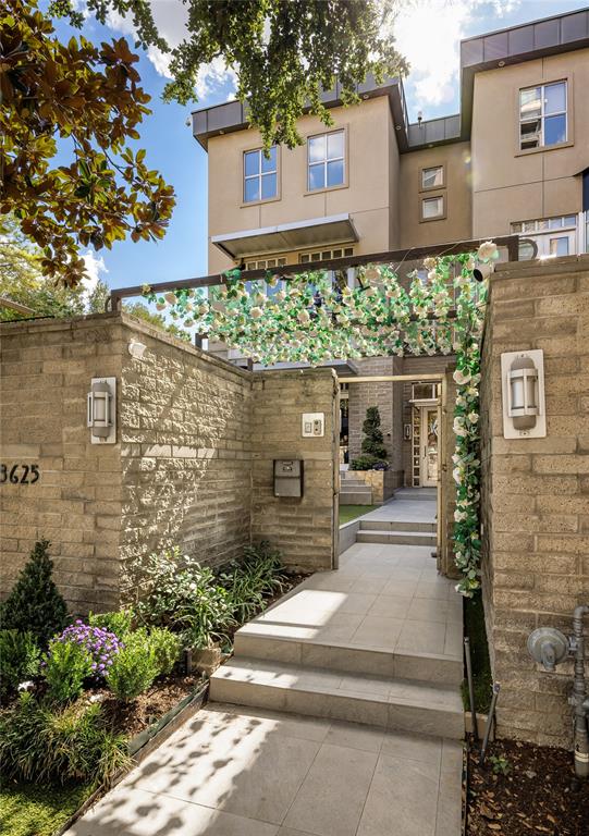 A sophisticated urban retreat in the heart of Mansion Park, this exceptional three-bedroom, 3.1-bath townhome offers 3,734 square feet of beautifully updated living space, exceptional outdoor areas, and a rooftop terrace with views of Old Parkland and Reunion Tower. Warm contemporary interiors pair with distinctive architectural details and impressive technology in this inviting home.Beyond the lushly landscaped front courtyard, the main level showcases light oak hardwoods that connect two living areas, dining room, and a striking Poggenpohl kitchen with quartz surfaces, Thermador appliances, Sub-Zero refrigeration, Miele built-in coffee system, and oversized enameled cast-iron sink. A Poggenpohl wet bar, double-sided fireplace, custom built-ins, and interior courtyard with an art installation by Brazilian artist Luiz Olinto distinguish the gathering spaces.Upstairs, a generous primary suite features a private balcony, walk-in closet, and double-sided fireplace shared with the remodeled bath featuring Porcelanosa tile, dual vanities, glass soaking tub, and walk-in shower. A second en suite bedroom doubles as a media room with 4K projector, 10-foot cinema screen, and surround sound.The third floor offers another en suite bedroom, currently a gym, plus a game room opening to the showstopping rooftop terrace. Designed for year-round enjoyment, it features an automated louvered pergola, fireplace and sitting area, outdoor kitchen, and six-person spa overlooking the city skyline.Additional updates include an upgraded Control4 smart-home system, automated LED lighting, remote-controlled shades, enhanced security, and an oversized two-car garage with epoxy floors, storage systems, workshop, and app-controlled door with camera.Just steps from the Katy Trail and near the restaurants, shopping, and entertainment of Oak Lawn and Uptown, 3625 Brown Street combines the space and privacy of a home with sophisticated lock-and-leave Dallas living.