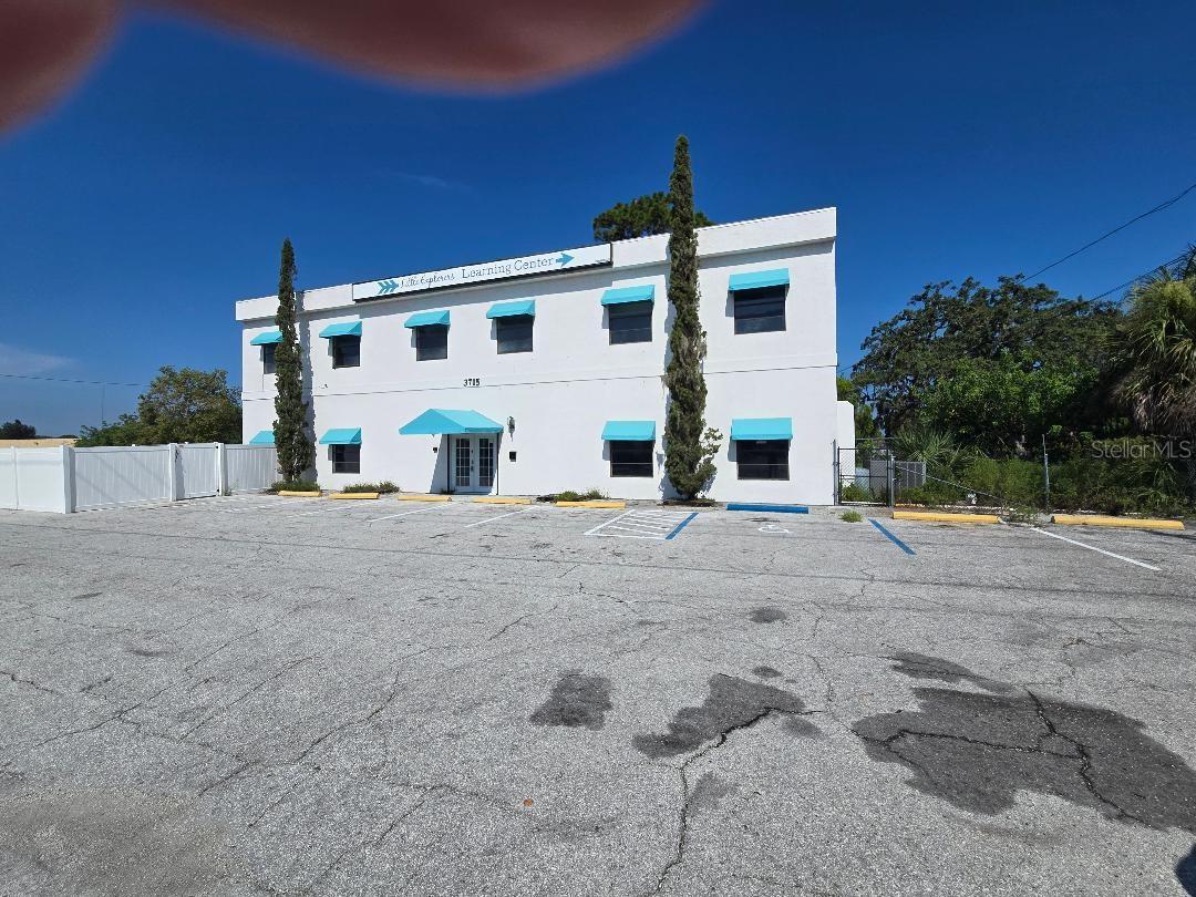 $50,000  PRICE IMPROVEMENT!!!  Seller says get it sold.  Ideal location right on US 19 in New Port Richey just south of SR 54 on west (southbound) side of 19. EZ drive to all points along US 19, Hillsborough and Pinellas Counties. 2 story building totaling 4,368 heated square feet. 1993 construction. Has most recently been used as
preschool. Partially fenced sides and rear for recreation areas. Numerous classrooms upstairs and down.  Kitchen. Nursery.  Exterior fire escape in addition to main stairs  from second floor to rear yard. Very EZ in and out from parking lot onto 19. 10-12' ceilings on first floor. Zoned C2. Suitable for professional office, retail, etc. Approximately 21 asphalt paved parking places across front of property.