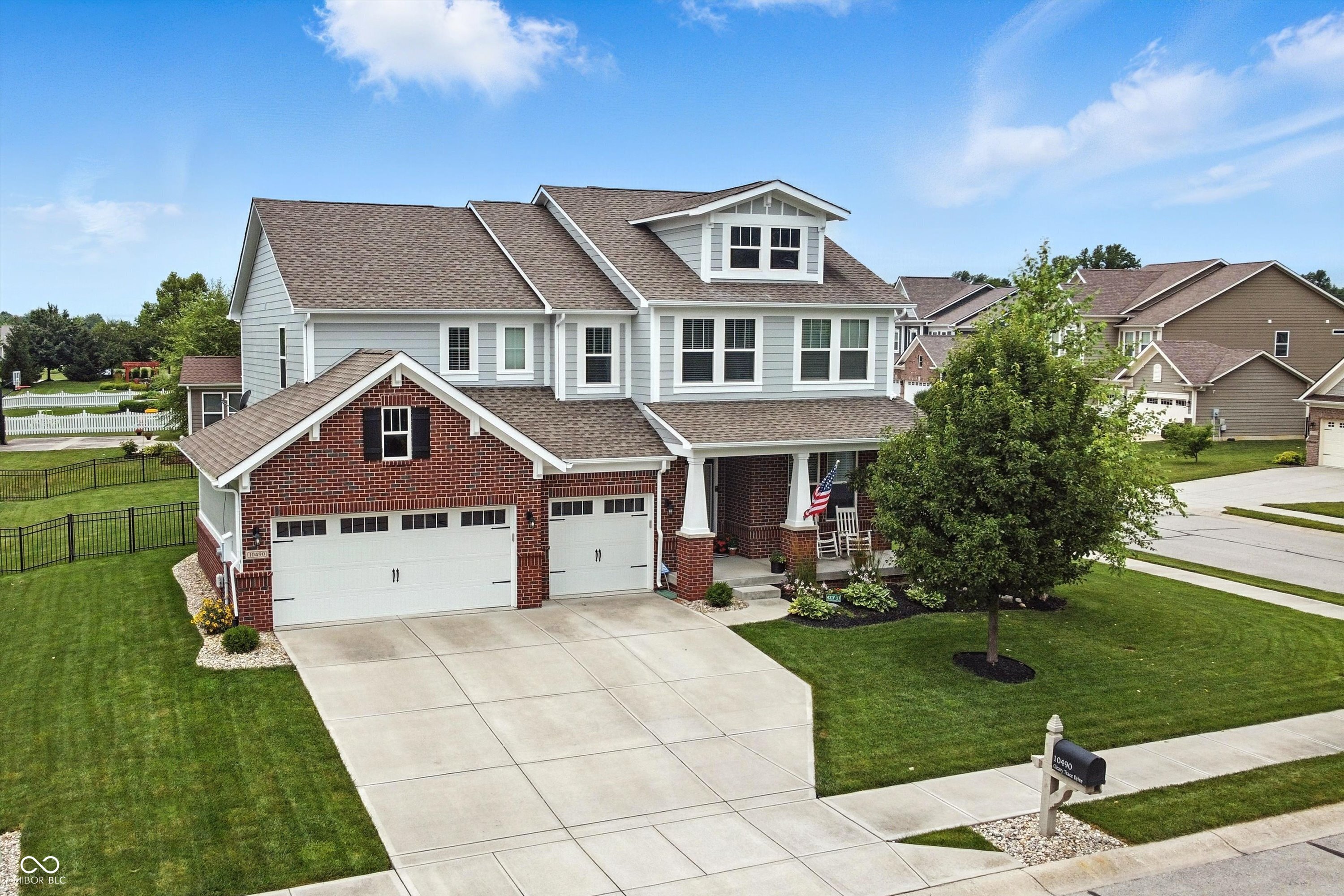 Welcome to this impeccably maintained 4-bedroom, 2.5-bath home on a spacious corner lot in the popular Prescott neighborhood of Fishers. Built in 2015, this home offers a thoughtful layout, quality finishes, and plenty of room to grow.  The main floor features a great balance of function and comfort, with a dedicated office, a convenient planning center, and an open-concept living space that works well for both daily life and entertaining. The kitchen stands out with built-in appliances, a large island, and generous cabinet space. The family room includes a gas fireplace, and just off the back, a covered patio overlooks the fully fenced backyard-complete with a patio extension and an irrigation system to keep the yard looking its best.  Upstairs, you'll find all four bedrooms plus a versatile loft. The primary suite includes double sinks, a tiled walk-in shower with a bench and a large closet that connects directly to the laundry room for added convenience. The full unfinished basement offers excellent storage space now and the potential to finish later as a home gym, theater, game room, or additional living area. A 3-car garage, well-kept landscaping, and close proximity to top-rated schools, parks, and shopping round out the features of this move-in-ready home.