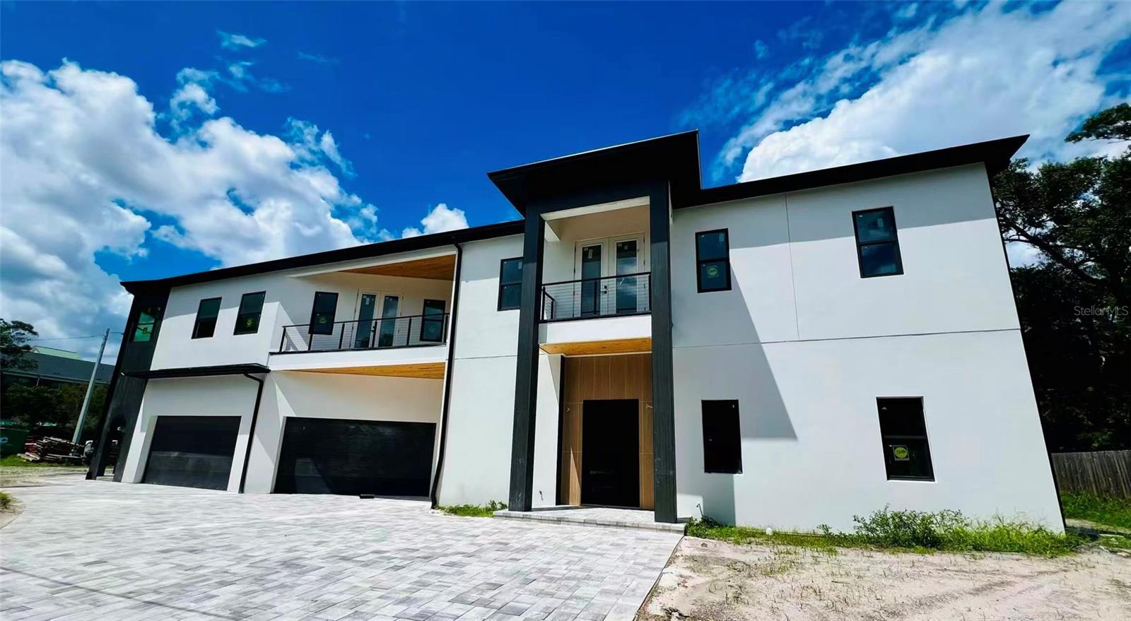 Under Construction. Under Construction luxury custom home in the very desirable Bay View neighborhood in South Tampa. No flood zone!  Anticipated completion toward the end of  2025.   This custom built home features 5 bedrooms, office, entertaining room, gym, 2 study rooms, 6 full bathrooms, 2 powder bathrooms and an oversized 3 car garage situated on a generous corner lot. This contemporary and warm home truly combines functionality and style!  To name a few features; Level 4 drywall, Hickory engineered wood flooring, 12 feet ceiling on the 1st floor and 10 feet ceiling on the 2nd floor, Monogram brand appliances,  outdoor kitchen, Four AC units, four under the counter refrigerators, electric fireplace, rare two driveways,  two balconies on the 2nd floor, Sunroom in the master suite, three laundry places including the laundry room, master suite laundry and in law suite laundry. The first floor features an in-law suite, gym and office. Nice patio with outdoor kitchen and paved backyard. The second floor has an open lobby, the master suite , three more bedrooms, and a media/entertaining room. Unbeatable location right behind  Plant High school.  The house is within 15 minutes to Tampa International Airport, Veteran's Express and I-275, within 10 minutes to Hyde Park Village & Downtown Tampa, and within 5 minutes to Palma Ceia Golf & Country Club. A-Rated school district with Roosevelt Elementary, Coleman Middle and Plant High. There is no CDD or HOA to worry about either!