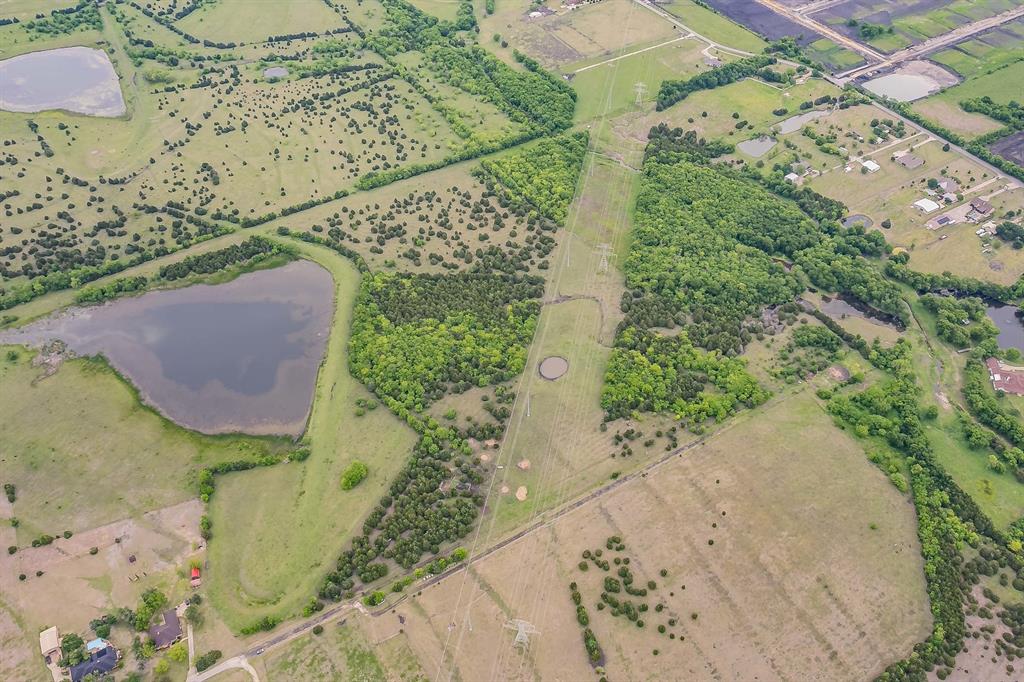 Rare opportunity to own a private, Ag-exempt estate just minutes from Rockwall's best amenities. This 61.73 acre property boasts ownership of Rocki Dell Lane, and offers the perfect blend of seclusion and convenience — all zoned to sought-after Rockwall ISD. Enjoy access to an 8.5-acre lake, offering excellent fishing, recreation, or simply peaceful views right outside your door. With no HOA and no restrictions against building, this property is wide open for its next chapter — whether that's a private family estate, a hunting and recreation getaway, or a development opportunity.The Ag exemption keeps taxes low while you decide your next move, and the current cattle lease can be continued for your convenience.  The property is also a part of McClendon-Chisholm ETJ, which gives developers a unique chance to benefit from city funds and tax incentives if desired. Bonus opportunity: An additional 31.49 acres is available at the front of this property, with a 4,000 sq foot home and 750+ feet of frontage on Rochelle Road. Sellers would love to sell all 92± acres together. Even better, if you're looking for more than 92 acres, there is a neighbor offering 22 acres off-market as well. Contact the listing agent for more details and bulk pricing — this is a rare chance to assemble a large, contiguous tract in a high-growth corridor. Location perks: 13 minutes to Lake Ray Hubbard 7 minutes to HEB Rockwall 8 minutes to Costco 12 minutes to Rockwall High School 12 minutes to Texas Health Hospital Sellers are motivated. Call or text listing agent for a private showing or more information on the full 92-acre package!