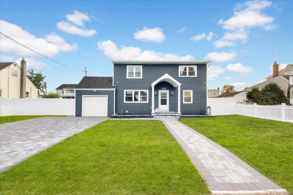 Welcome Home to This Stunning Mother-Daughter Home in Lindenhurst!Discover the perfect blend of comfort, style, and versatility in this beautiful 4-bedroom, 3-bathroom home in desirable Lindenhurst! Featuring a bright, open-concept layout, this inviting residence is ideal for both everyday living and entertaining family and friends.Step inside to find gorgeous hardwood floors and an abundance of natural light throughout. The spacious kitchen shines with new stainless steel appliances and elegant quartz countertops, creating a stylish and functional space for cooking and gathering. Enjoy year-round comfort with  A multi zone new Duckless system.Step outside to a generous backyard, perfect for summer barbecues, outdoor dining, and making lasting memories. Major exterior updates—including a new roof, new siding, and new windows—add to the home's appeal.The full basement offers endless possibilities, whether you envision a recreation room, home gym, media room, or additional storage space.With its versatile mother-daughter layout, inviting living spaces, modern updates, and desirable Lindenhurst location, this home is an exceptional opportunity for buyers seeking space, comfort, and flexibility.A home with so much to offer—come see it for yourself and imagine the possibilities!