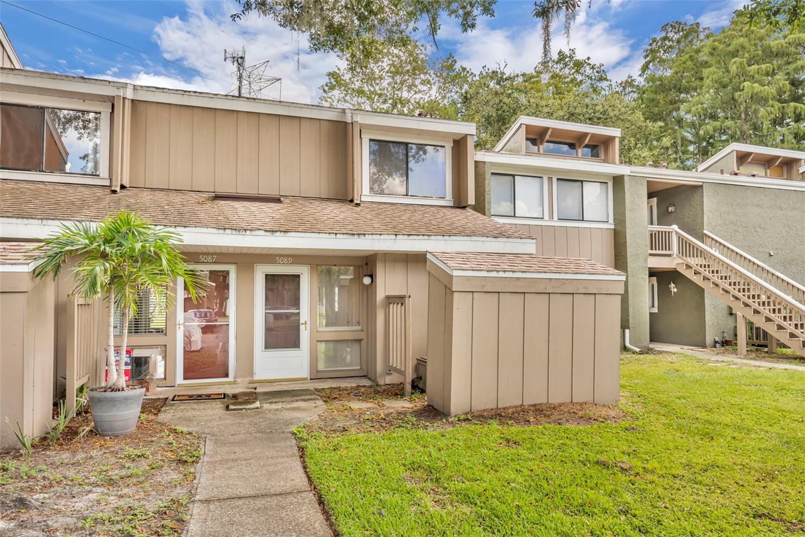 Now is the perfect time to call this beautifully remodeled 2-bedroom, 1.5-bath condo your new home! Tucked inside a peaceful community, this two-story retreat has been thoughtfully updated from top to bottom, offering modern comfort, timeless style, and a serene setting you’ll love coming home to.

From the moment you walk in, you’ll notice the attention to detail. Brand-new flooring flows throughout the bright, open layout, creating a seamless and inviting feel. The spacious living area is perfect for both relaxing evenings at home and entertaining friends. Just off the living space, large windows and sliding glass doors bring in abundant natural light while showcasing calming pond views.

The kitchen is a true highlight, featuring sleek countertops, contemporary cabinetry, and stylish fixtures. Whether you’re whipping up a quick meal or hosting a dinner party, this kitchen makes cooking a joy. Both bathrooms have also been tastefully renovated, offering modern finishes and a clean, fresh design. Upstairs, two spacious bedrooms provide the perfect retreat, each with plenty of natural light and storage.

Step outside to enjoy your private patio overlooking the tranquil pond—a perfect spot for morning coffee, evening sunsets, or simply unwinding after a busy day. Beyond your door, the community offers fantastic amenities, including a sparkling swimming pool, tennis courts, and well-maintained green spaces. It’s a lifestyle designed for relaxation and connection.

The location truly can’t be beat. Just minutes away, you’ll find Universal Studios, Disney World, world-class shopping, dining, and entertainment. Top-rated schools, parks, and everyday conveniences are also nearby, making this home as practical as it is charming.

This move-in ready condo blends modern updates, a prime location, and a peaceful atmosphere—all at once. Homes like this don’t come along often.