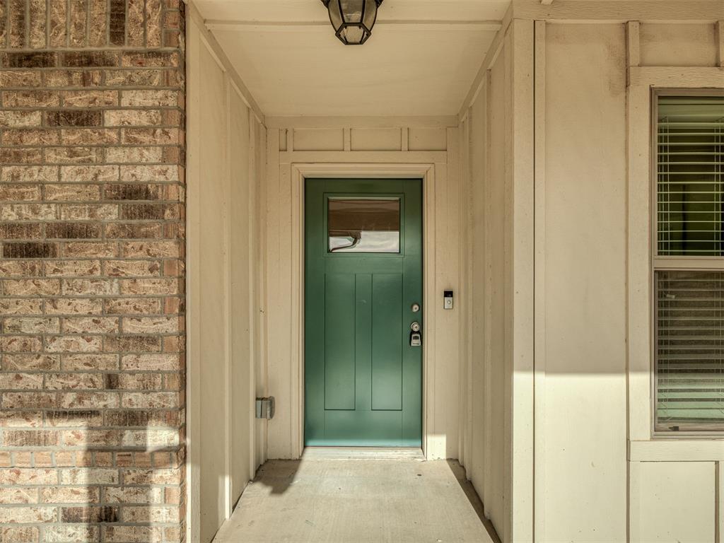 Welcome to 521, where modern style meets everyday functionality. This charming home welcomes you with a large front porch, a rarity in Edmond. Inside, the open-concept layout is filled with natural light, creating a bright and welcoming atmosphere. At the heart of the home, the kitchen features a spacious island ideal for meal prep and gatherings, stainless steel appliances, and two pantries offering exceptional storage. Large living room and freshly painted dining room round off the public spaces. Just off the main living area, French doors open to a flexible study space—perfect for a home office, media room, or additional bedroom. A split floor plan offers privacy and comfort, with the primary suite positioned separately from the secondary bedrooms. The primary retreat includes clerestory windows, a spa-inspired ensuite with a garden tub, separate shower, and an oversized walk-in closet. The secondary bedrooms are generously sized and feature ceiling fans and ample storage. Both bedrooms share a modern guest bathroom complete with a tub/shower combination and clean, contemporary finishes. The backyard is perfect for BBQing and hanging with friends and family on the large covered porch. Additional upgrades include an in-ground storm shelter and a Rinnai tankless water heater. Ideally located near shopping, dining, entertainment, Downtown Edmond, and the turnpike, this home delivers convenience and quality in one exceptional package. Schedule your showing today—let's go look!