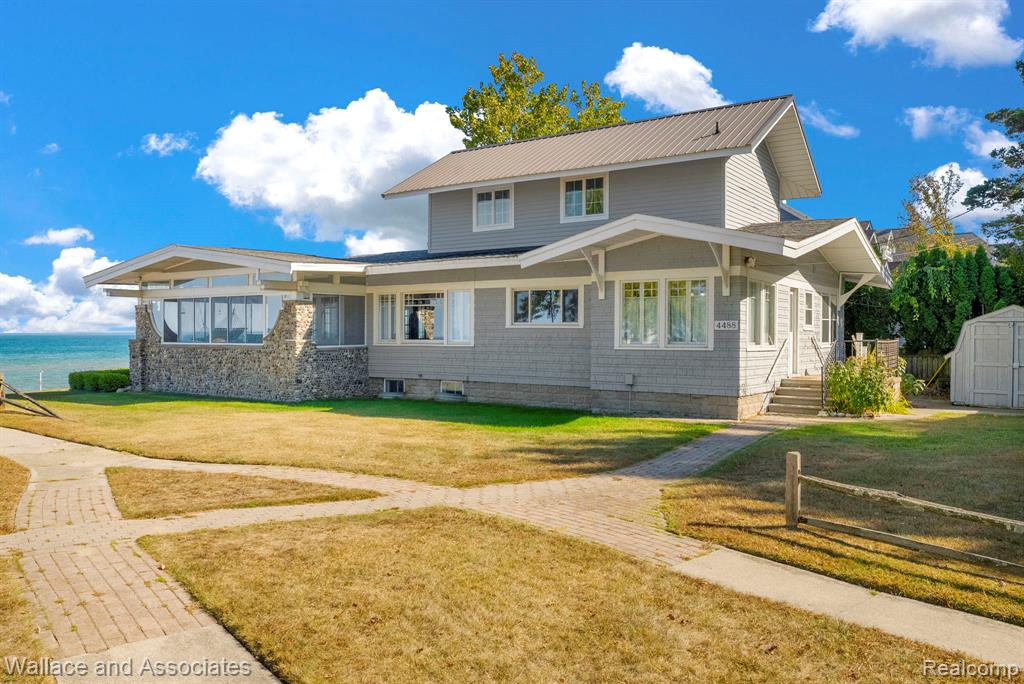 Enjoy the best of lakeside living in this charming 3-bedroom, 2-bath home offering 1,722 square feet of comfortable living space over looking almost 59 feet of beachfront on the shores of Lake Huron. The standout 3-seasons room invites you to relax and take in panoramic views of the water, perfect for morning coffee, evening sunsets, or hosting guests. The gorgeous stamped concrete patio beckons for beachside grilling on summer days. Inside, the home features a spacious layout with generous natural light and cozy living areas ideal for year-round use or seasonal enjoyment. Whether you're looking for a peaceful getaway or a full-time residence, this property delivers the perfect blend of comfort, scenery, and lake lifestyle.