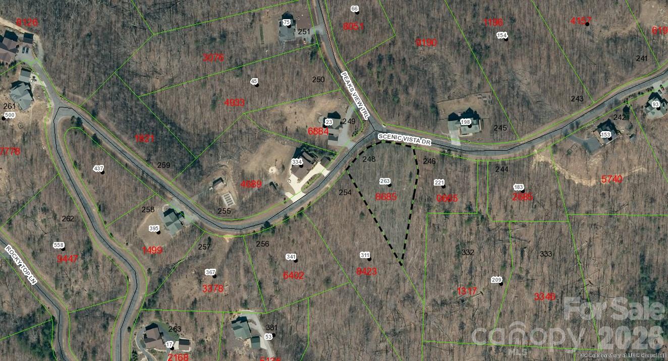 Beautiful wooded building lot with mountain view potential in the popular gated community of Grandview Peaks.  This 0.9 acre homesite offers wooded privacy and a gentle slope, making your custom home build easy and affordable. There is great mountain view potential with the clearing of a small amount of trees or nestle off the road to enjoy a home lovingly tucked away amongst the forest. The community offers miles of hiking trails and a small community lake that's stocked for fishing.  The white sand beach is the perfect place to work on your tan or go for a refreshing swim. The lakeside pavilion offers a convenient setting for your family picnic or to gather with neighbors at one of many weekly community events.  The quaint towns of Marion & Morganton are just 20 minutes away and Asheville is less than an hour. Come see what a peaceful life in the mountains can offer!