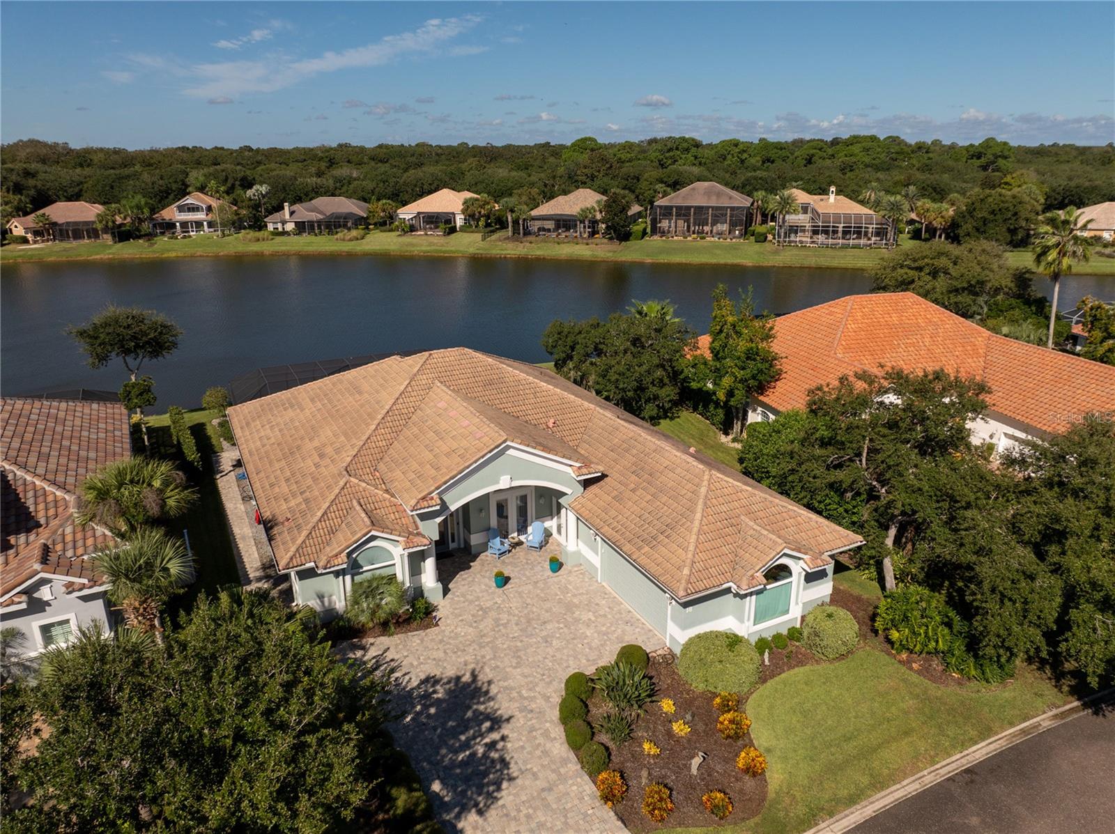 POND-VIEW POOL & SPA HOME IN THE GATED COMMUNITY OF OCEAN HAMMOCK! Beautifully UPDATED tile roof 4-bedroom, 3-full-bath home offering a spacious and versatile floor plan with exceptional indoor and outdoor living. The inviting family room features a stunning stacked-rock accent wall and electric fireplace, creating an impressive focal point. Surround sound creates a theatre experience. Enjoy peaceful pond views from the primary bedroom, family room, and office/4th bedroom. The updated kitchen features a double oven, gas range. While luxury vinyl flooring and updated bathrooms add a fresh, contemporary feel.Motorized sheer shade blinds enable darkening or a open window view. Step outside to your private pool and spa retreat, surrounded by new pavers and a new pool screen enclosure. Walk to your private beach access only half mile away. This inviting outdoor space is perfect for relaxing, entertaining, and enjoying Florida's year-round lifestyle. A separate hobby room provides valuable flexible space for crafts, a studio, a gym or workshop, office, or storage.Located in the desirable Ocean Hammock community, featuring a guarded entrance, community pool, and clubhouse. A rare combination of tranquil pond views, private pool and spa, stylish updates, flexible living space, and desirable community amenities.  For those seeking an elevated resort experience, optional membership to Hammock Beach Golf Resort & Spa provides access to membership privileges that may include golf and additional resort amenities based upon the membership selected. This isn't simply another Palm Coast home, it's an opportunity to live the Florida resort and beach lifestyle every single day, with your own private pool and golf course views waiting just outside your door.Come experience the Florida lifestyle at 18 Oak View Cir E!