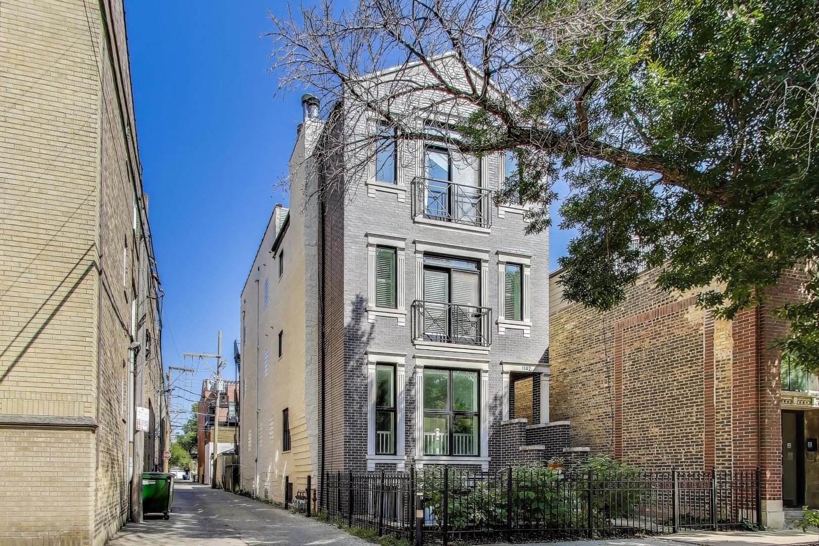 Stunning 2 bedroom, 2 bath Penthouse in brick 3 flat with private roof deck on beautiful tree-lined  street in Wrigleyville/ Lakeview! This sun- drenced condo features soaring 14 foot vaulted ceilings with skylights in the living room, dining room and kitchen and 10 foot ceilings throughout the rest of the unit. Beautiful gut rehabbed kitchen with peninsula seating, quartz counters, custom cabinets and high end appliances. Stylish gut rehabbed hall and primary baths. Additional amenities include, juliette balcony, hardwood floors throughout, wood burning fireplace with gas starter (behind the tv), prof. organized closets, addl. storage, garage parking and large rear deck leading to awesome private rooftop deck with 360 degree unobstructed views of the City, Skyline and Wrigley Field. Fantastic location, walk to Wrigley Field, Southport Corridor restaurants, shops, entertainment and both Red and Brown line "L" stops.